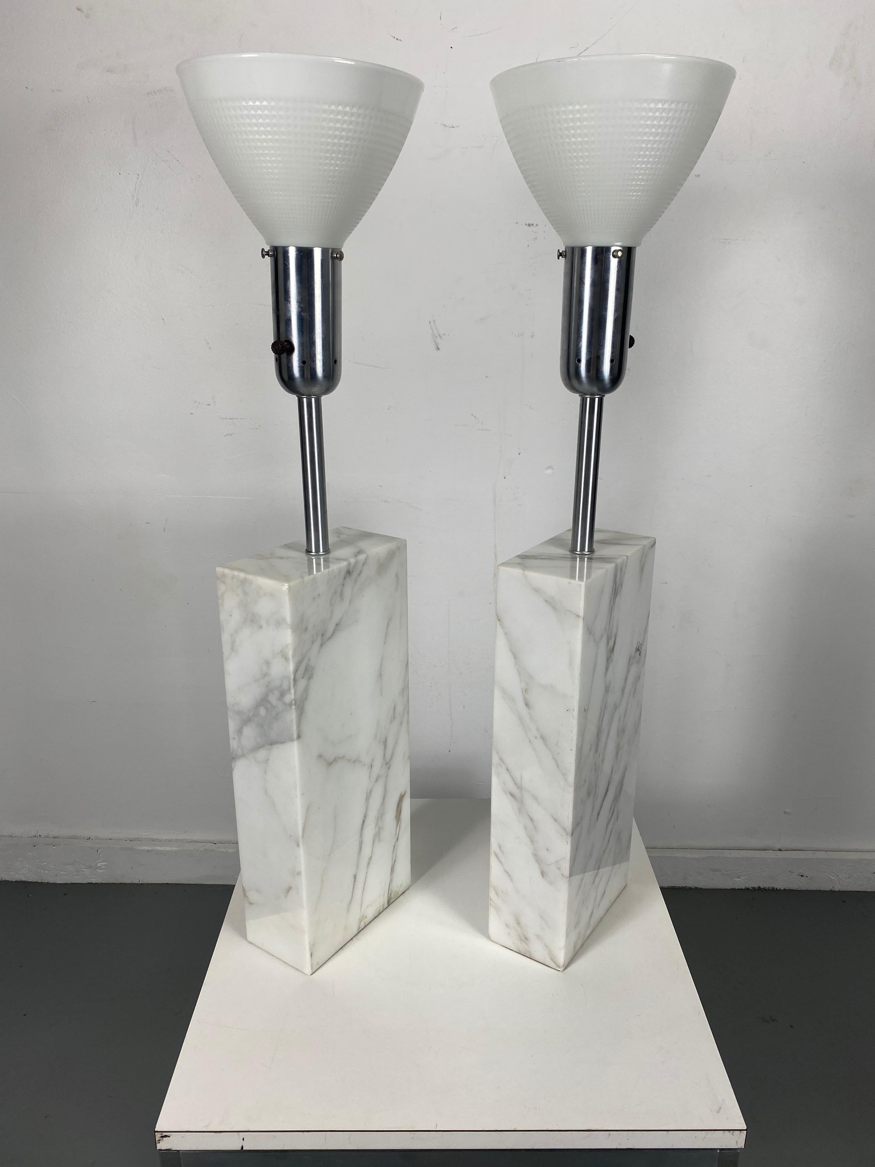 Substantial Elizabeth Kauffer attributed Nessen Studios solid white carrara marble & brushed steel lamps, 1950s. Featuring a solid, architectural, white and gray veined marble rectangular column, Brushed steel neck and socket with (6 H x 8 D) White