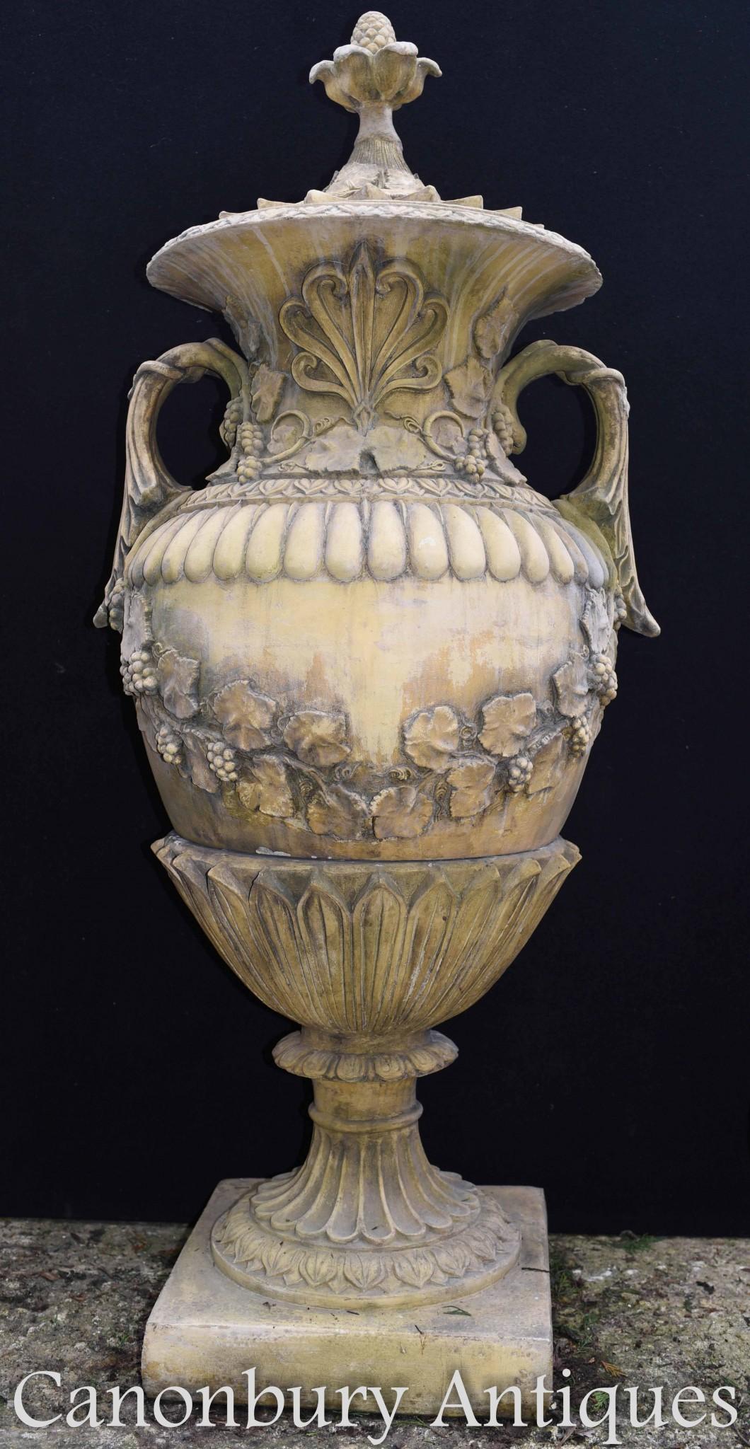 Exquisite pair of large English garden urns of amphora form
 Great pair for the classically inspired English landscaped garden
 Proffusely decorated with floral motifs and a leaf sash
 Lids come off and the urns come in two parts

Canonbury