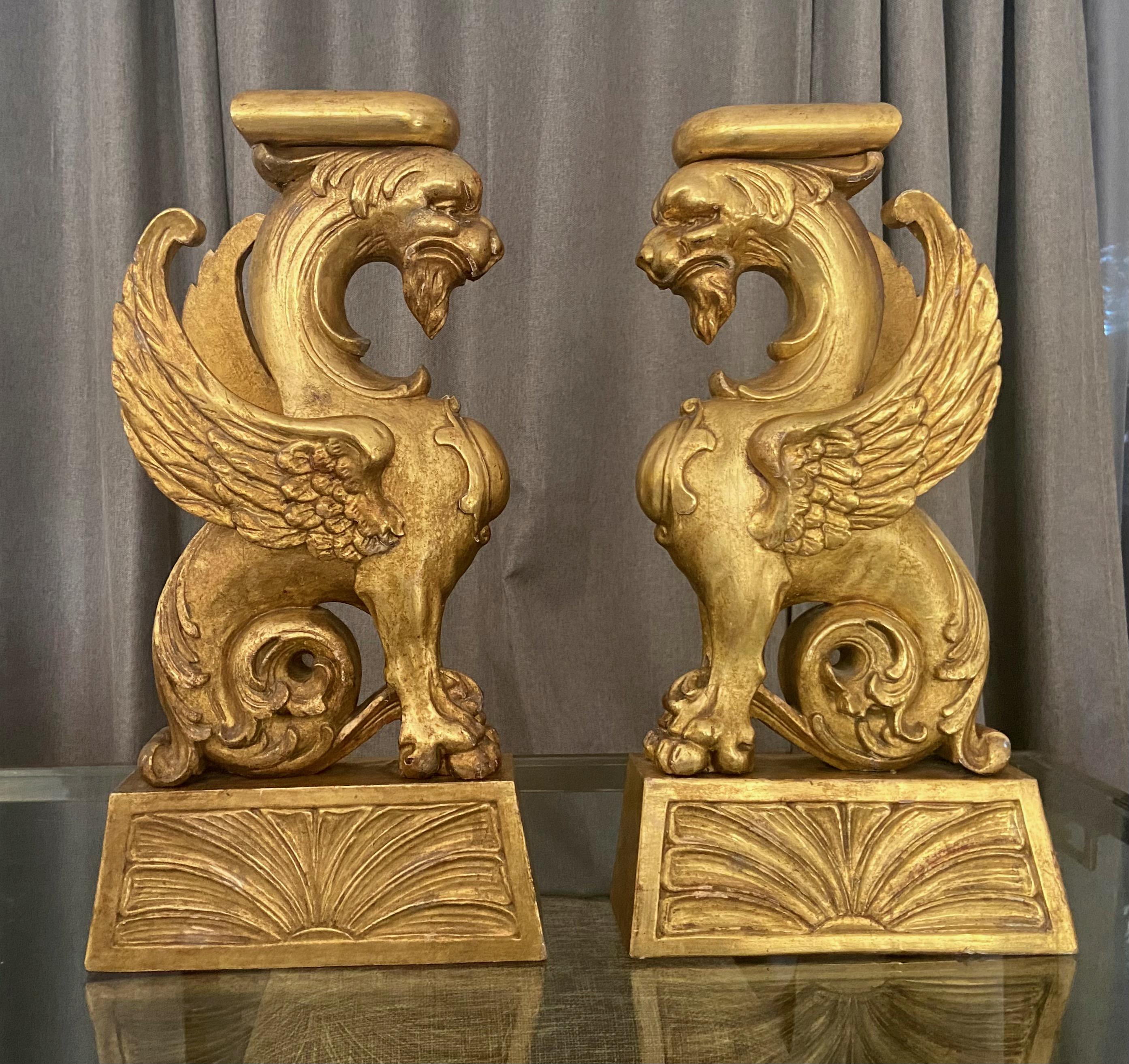 Pair of majestic French 19th century carved 23k giltwood mythological Griffin sculptures. Expertly carved. These impressive one of kind griffin sculptures (or statues) were architectural elements converted to decorative display art.

The griffin is