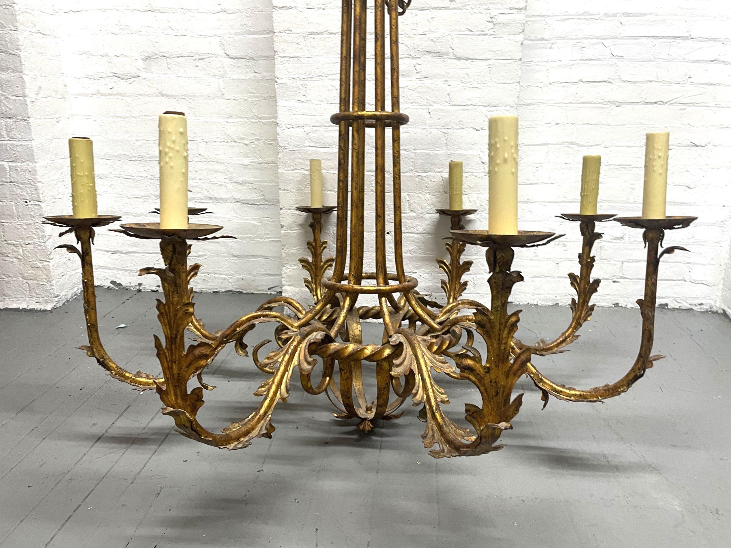 Pair of Large Gilt Metal 8 Arm Chandeliers.  Each arm has a floral pattern.