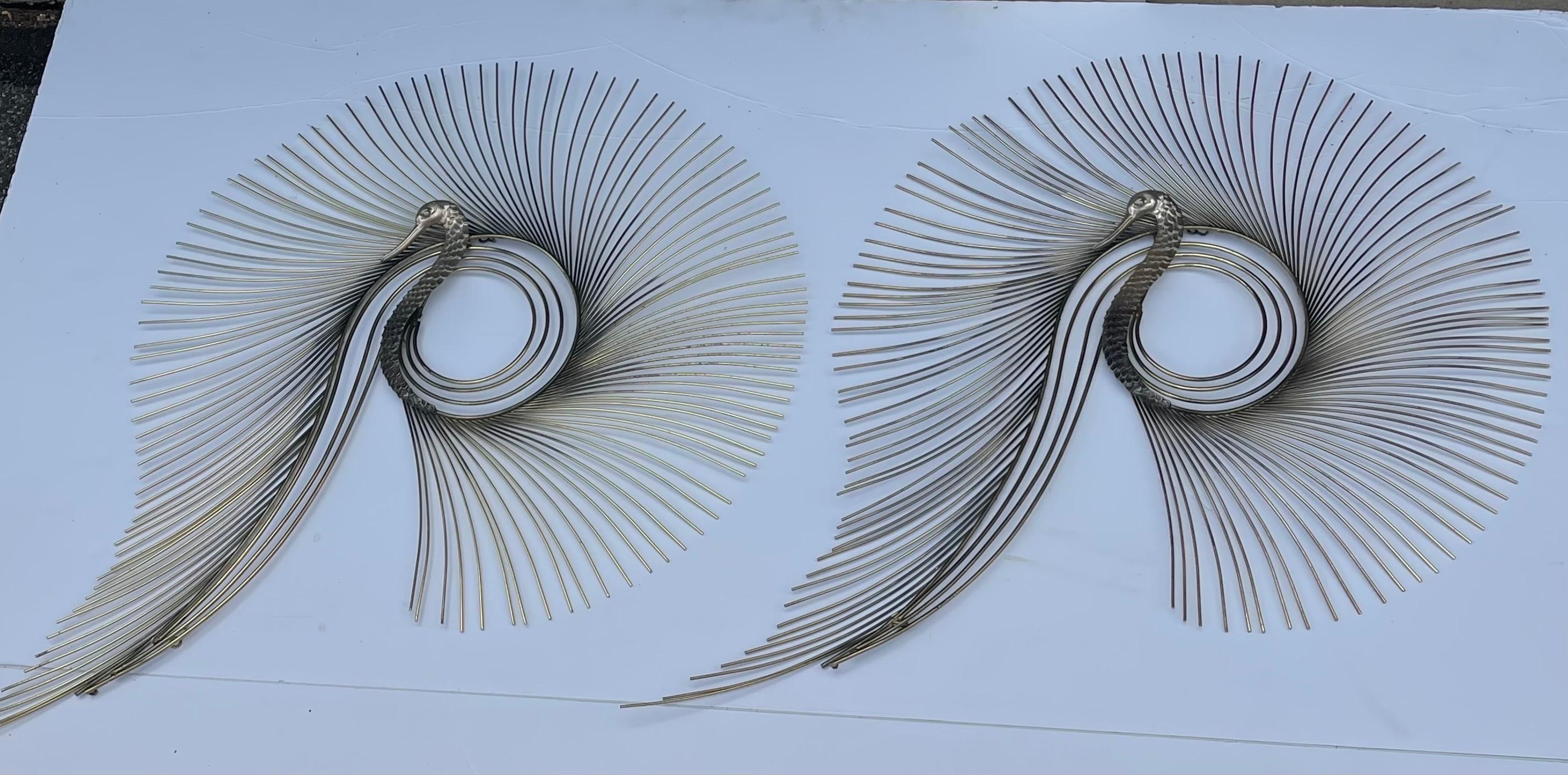 Signed Curtis Jere Pair Large Mid-Century Brass Swan or Peacock Metal Wall Sculptures 

Large and striking vintage brass wall sculptures designed and made by artist Curtis Jere. These sculptures each have a cast hammered brass peacock head with