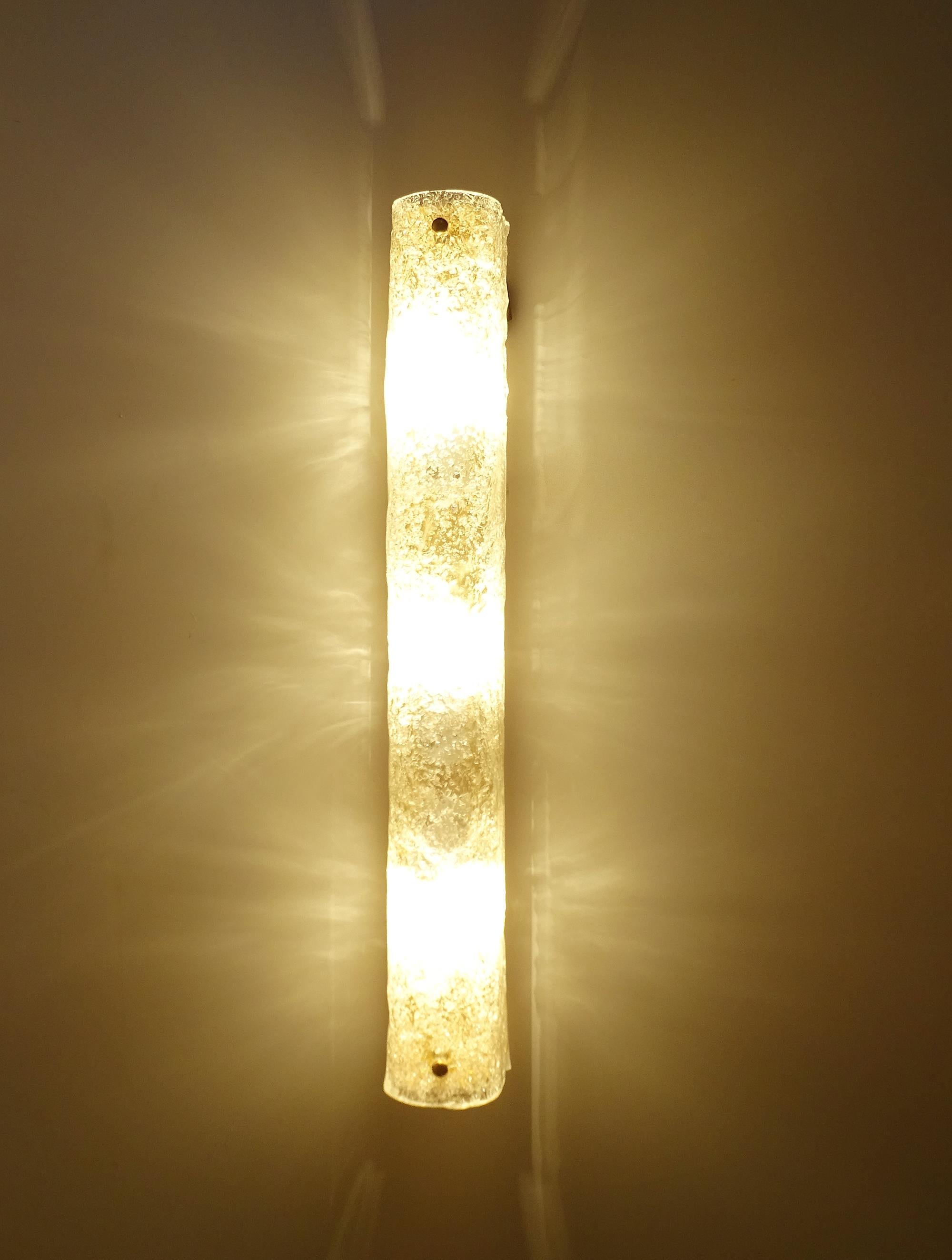 Rare and fabulous of vintage midcentury large tubular sconces by Hillebrand with handcrafted Murano glass, They have a brass base, versions which were produced in very small output with three porcelain fitting, each for E27 standard screw bulbs to