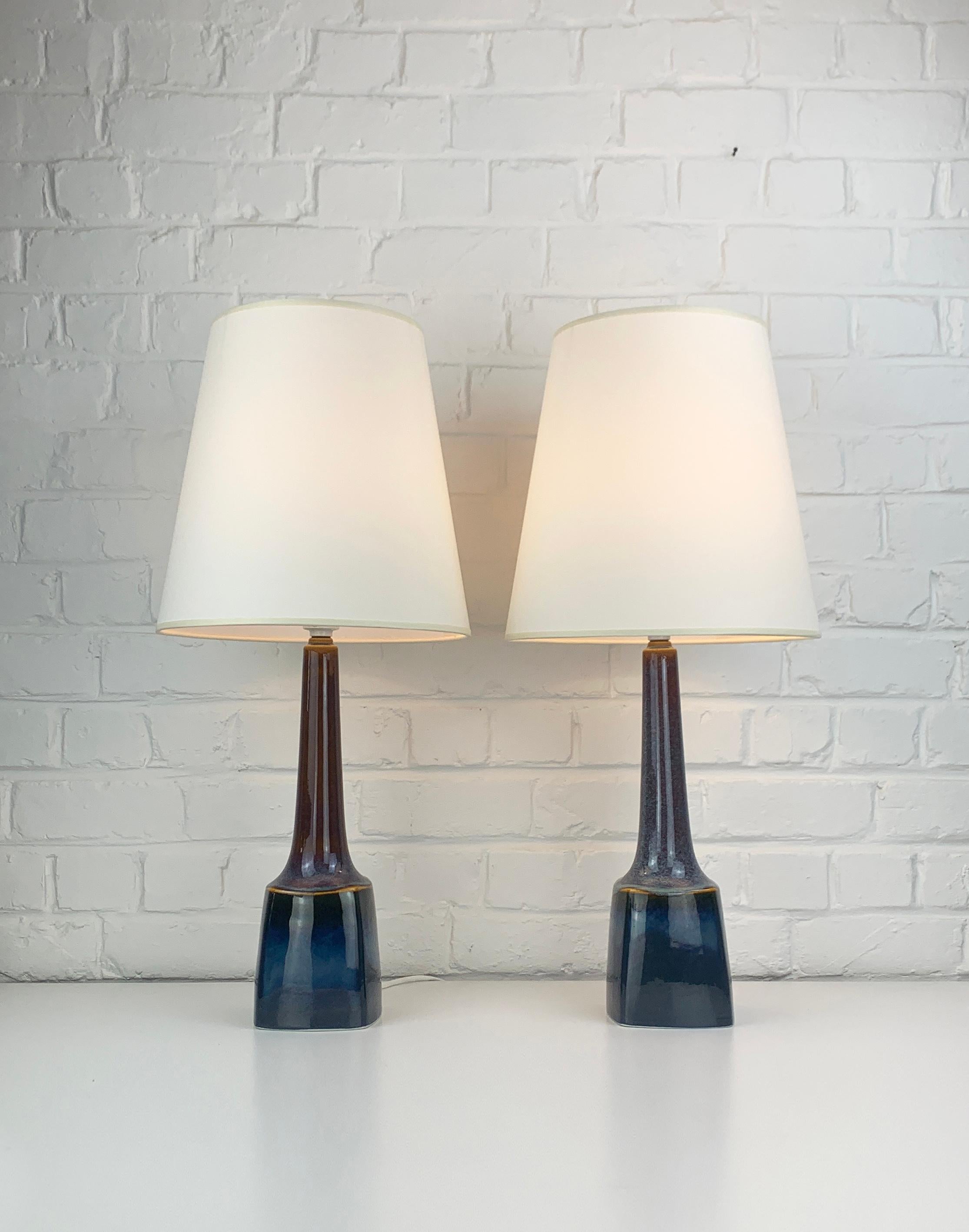 Pair of large Mid-Century ceramic table lamps. 
Model 941 created by Einar Johansen.

These lamps have been made by Søholm Stentøj (Soholm pottery) on the island of Bornholm, Denmark, in the 1960-70s.

Beautiful enamel colors in different shades and