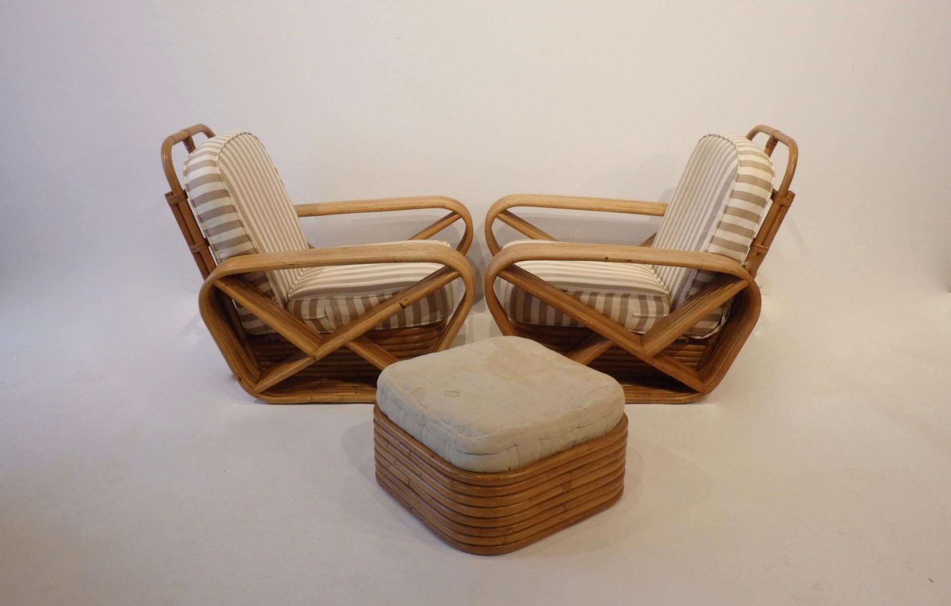 Part of a large estate suite of bamboo furniture recently purchased. Two wide bamboo club chairs. Six bands of bamboo across on each arm. Frames are in excellent condition. All cane wrappings intact. Shown with as found estate cushion covering.