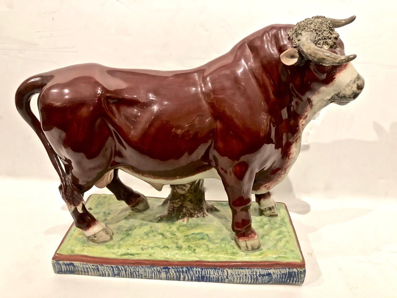 This is a very rare pair of large Staffordshire bull and cow animal figures that date to circa 1810. Both figures are in exceptionally good condition, having survived over 200 years without damage. There are a couple of very minor scratches and very