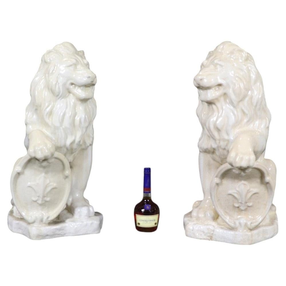 Pair Large White Glazed Ceramic Figures of Entryway Lions Paws Raised on Shield For Sale