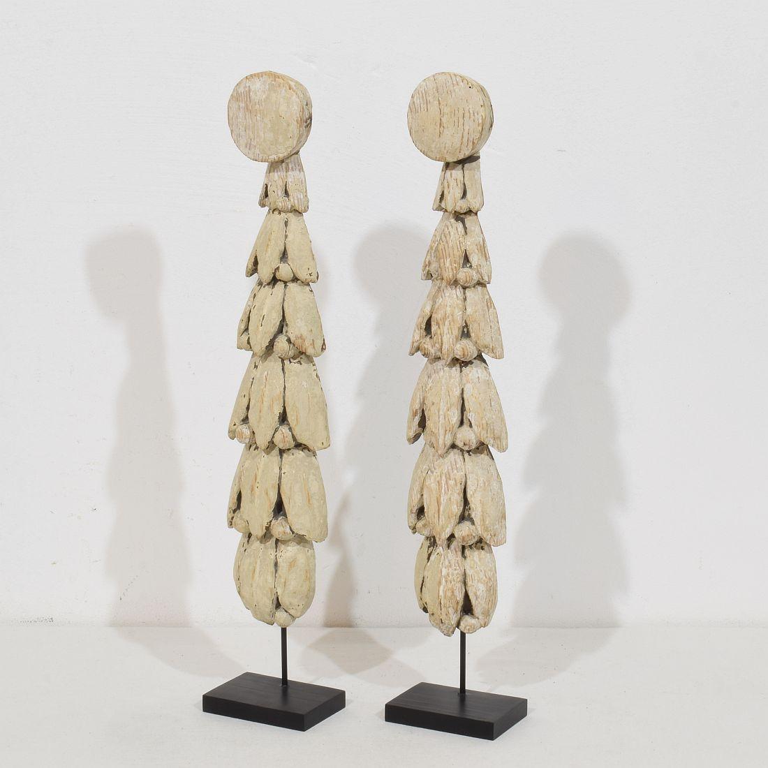 Beautiful pair 18th century neoclassical carved wooden ornaments.
France circa 1780.
Weathered, small losses and old repairs.
Measurements are individual and include the wooden base.
H:44cm  W:8,5cm D:6cm 