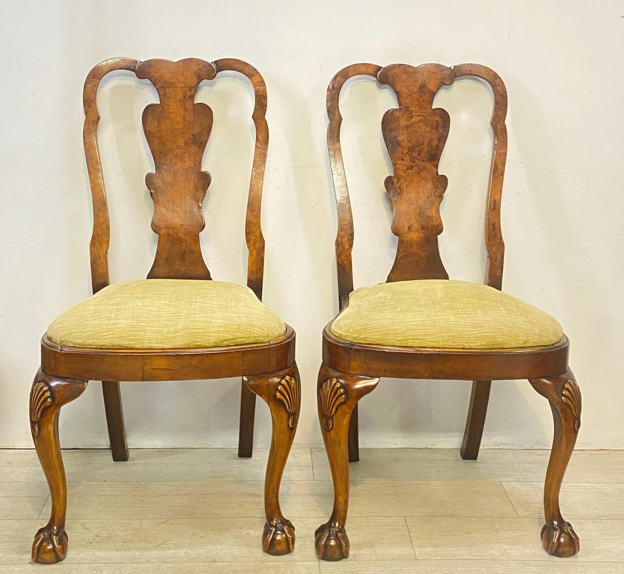 A pair of classic late 19th - early 20th century Chippendale style side dining chairs.
Burled walnut veneer over solid walnut, with upholstered seat.
Beautifully patinated old finish in good condition. Quality bench made chairs in the late 19th or