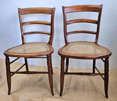 Pair Late 19th Century Victorian Walnut and Cane Seat Ladder Back Side Chairs