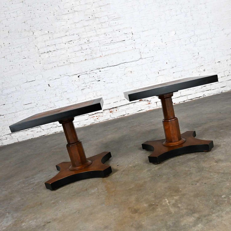 Pair Late 20th Baker Furn Campaign Style Black and Natural Pedestal End