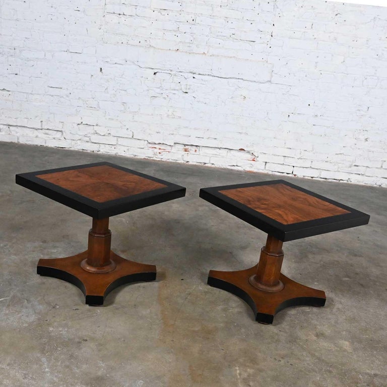 Pair Late 20th Baker Furn Campaign Style Black and Natural Pedestal End