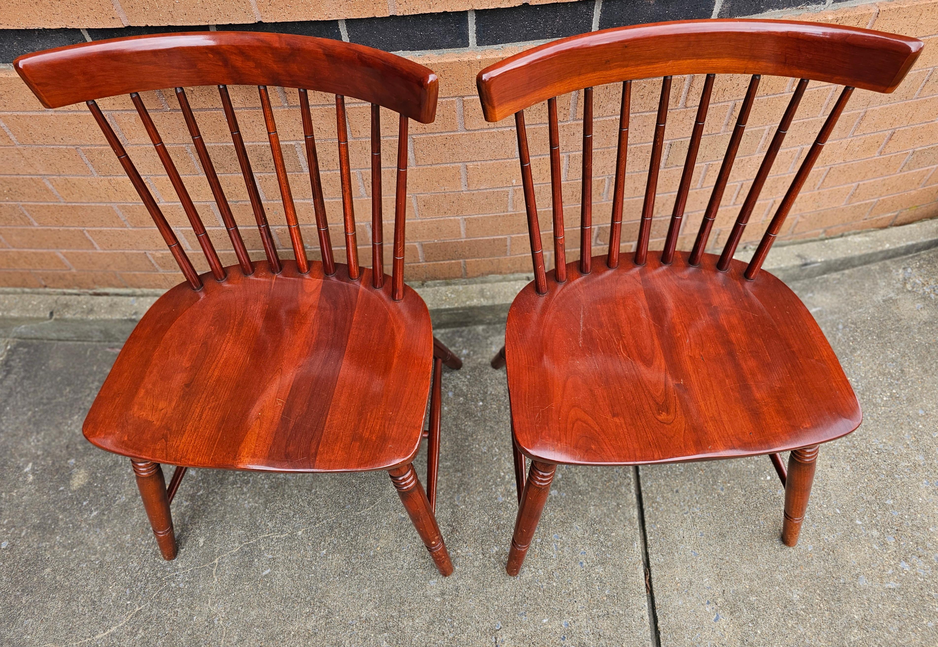 Late 20th Century Solid Cherry Spindle back Windsor Style Chairs with saddle back seat and with great finishes . Measures 23