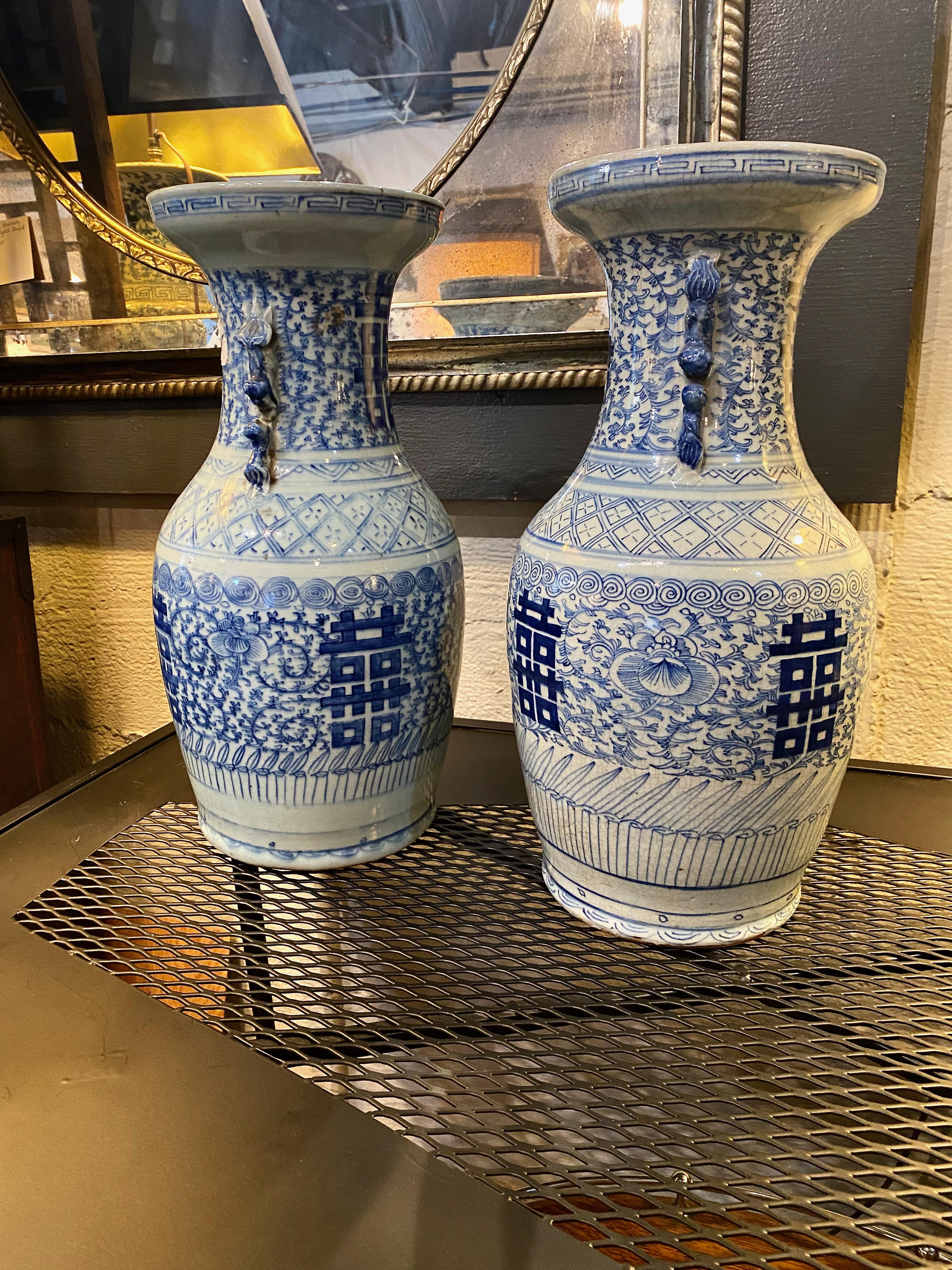 This a great (very) near-pair of late Qing large vases in the scrolling vine and double happiness pattern. These vases are in overall very good condition. No faults or cracks are noted, as shown in photos, there is a bit of crazing to the under lip