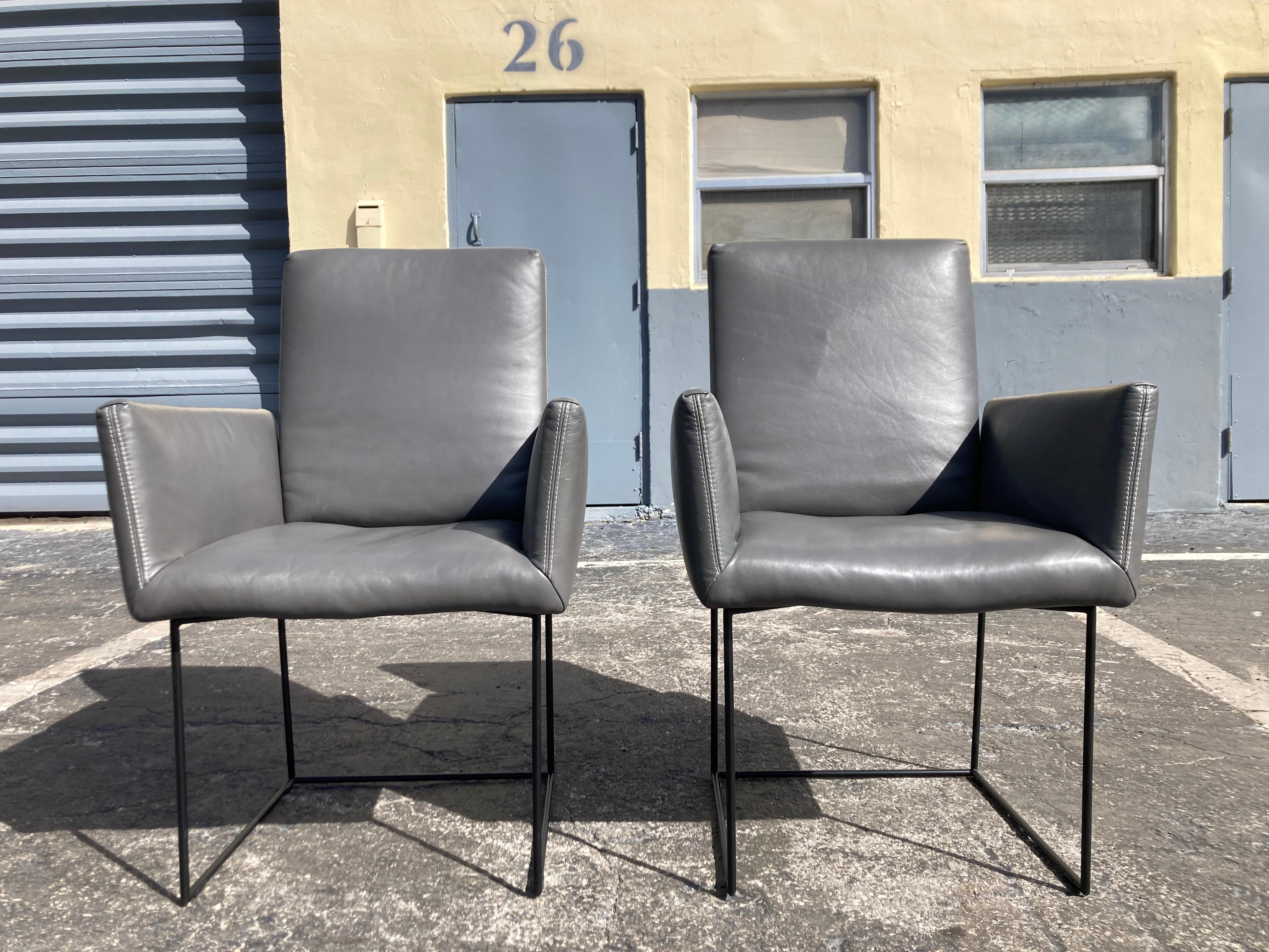 Pair of Casino Leather Arm Chairs Designed by Kurt Beier & Kati Quinger for Bullfrog. Made in Germany, gray leather and black steel base. Back is adjustable.