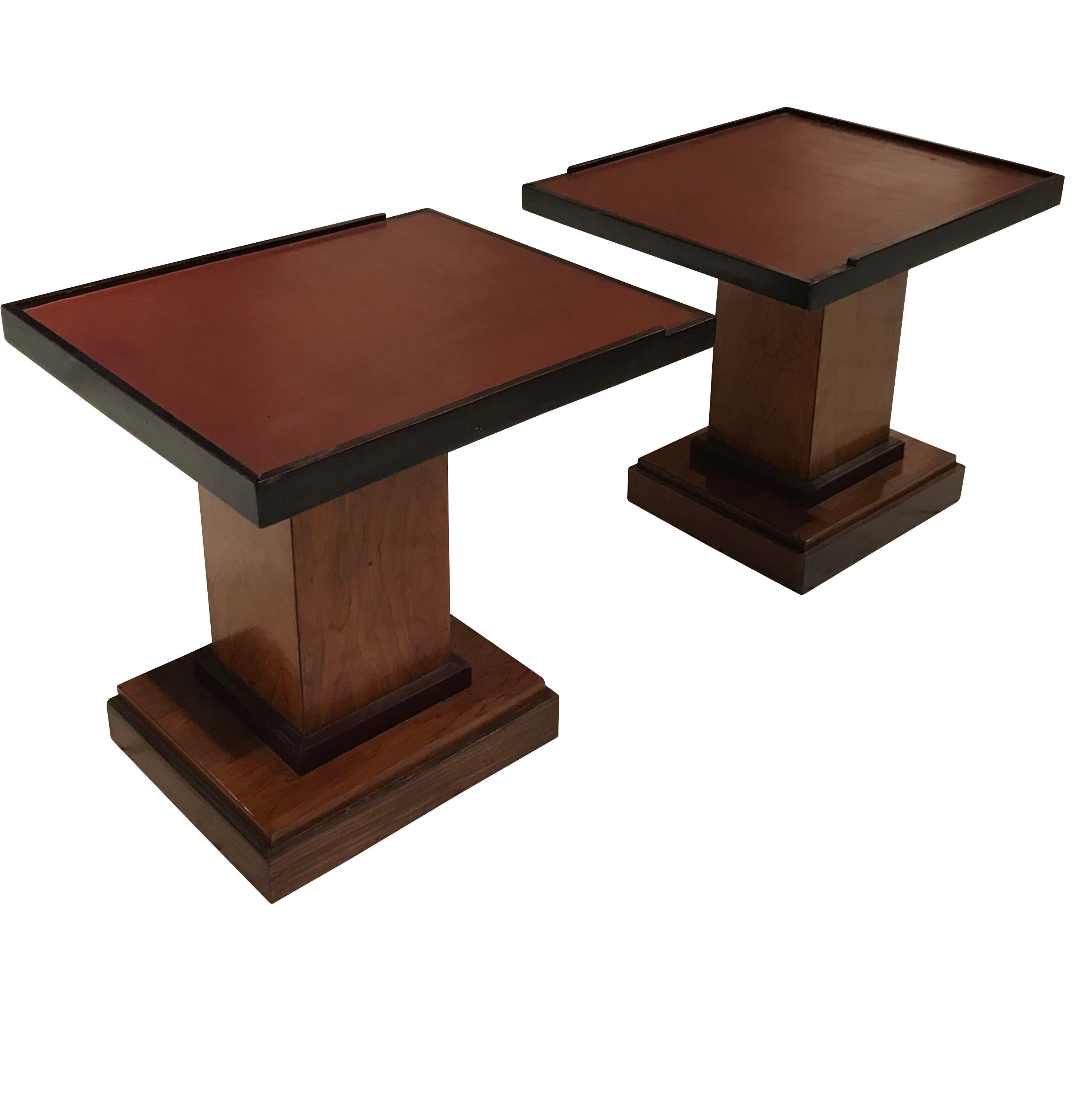 1970s French pair of rosewood coffee tables with cordovan colored leather tops
Accented brown trim.