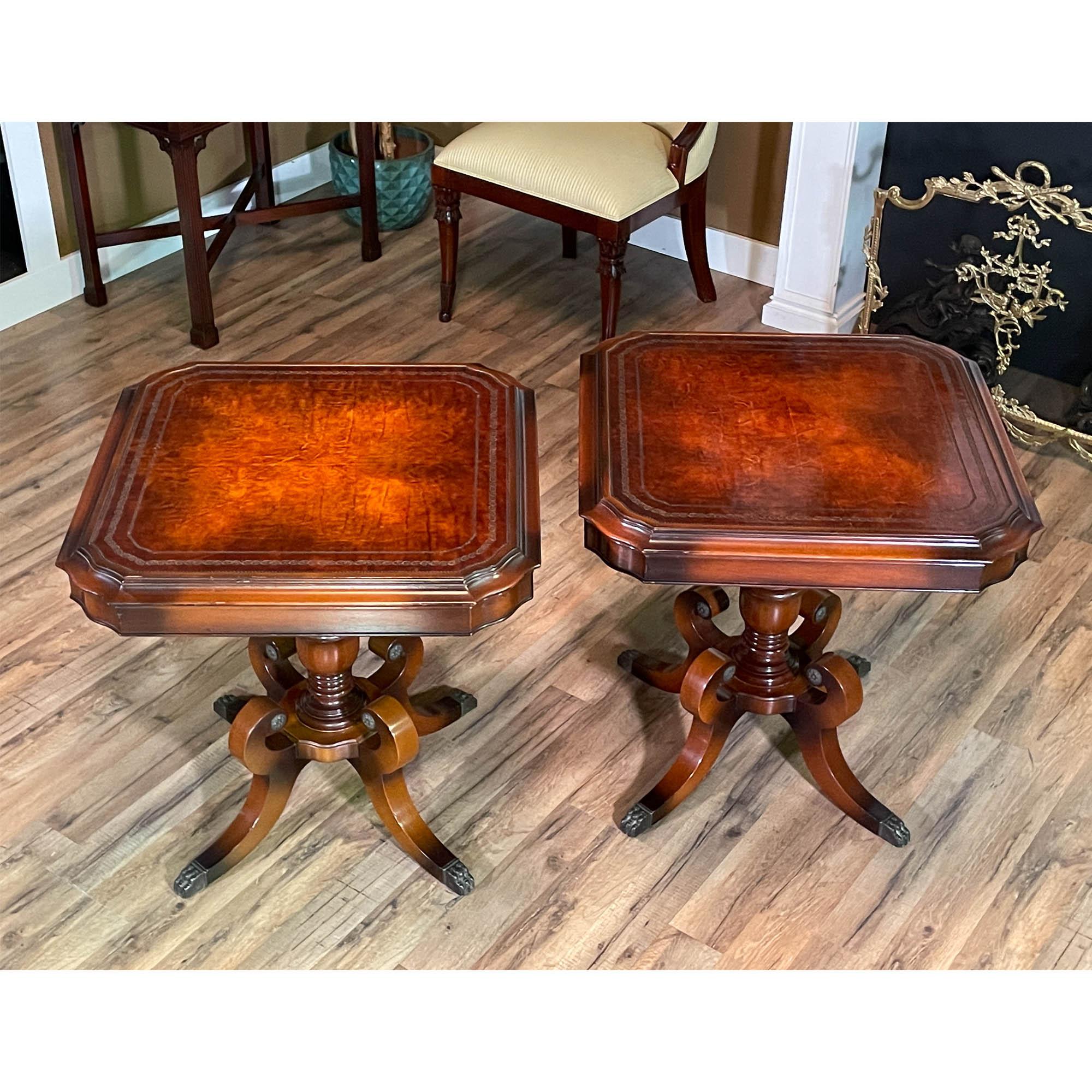 A PAIR Leather Top Tables featuring beautifully detailed leather tops and stylish bases. Very nice quality tables created in the middle of the 20th Century with a stylish, multi toned finish and very colorful leather. These tables are eye very