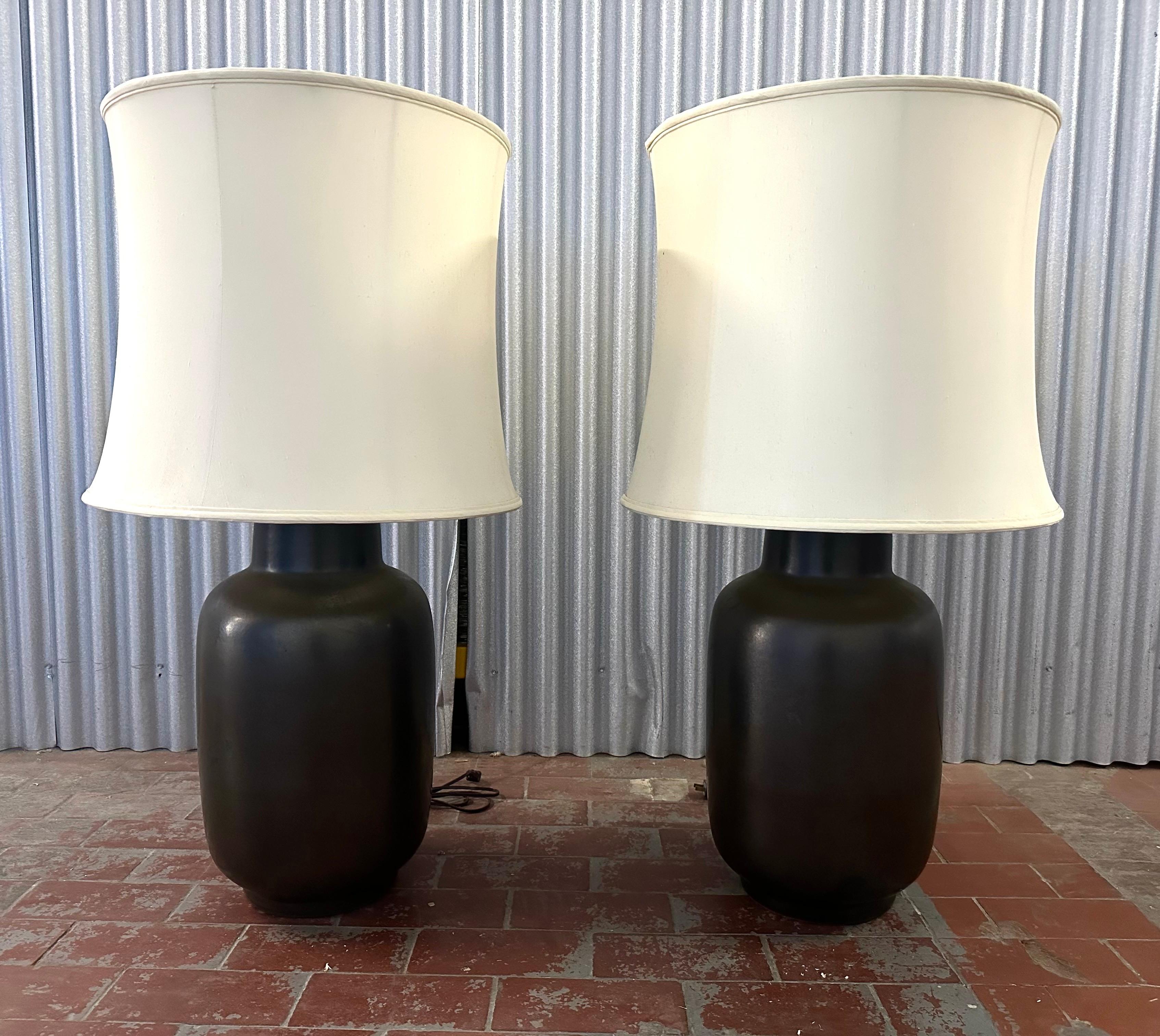 Oversized examples of a classic Design Technics reduced ginger jar form Model CL 203, in an elegant  monochrome gunmetal glaze.  The hand thrown vessel employs expert glazing over red terracotta pottery. 

Through simplified forms and muted glazing,
