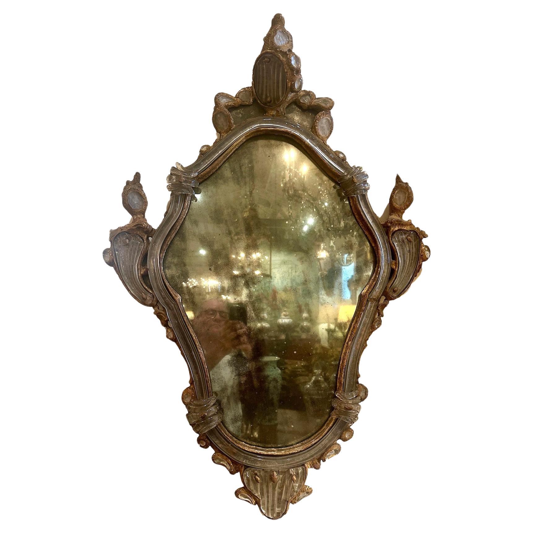An elegant pair of left and right, Venetian, gilt-wood mirrors with original 
molded glass and mirror glass.
