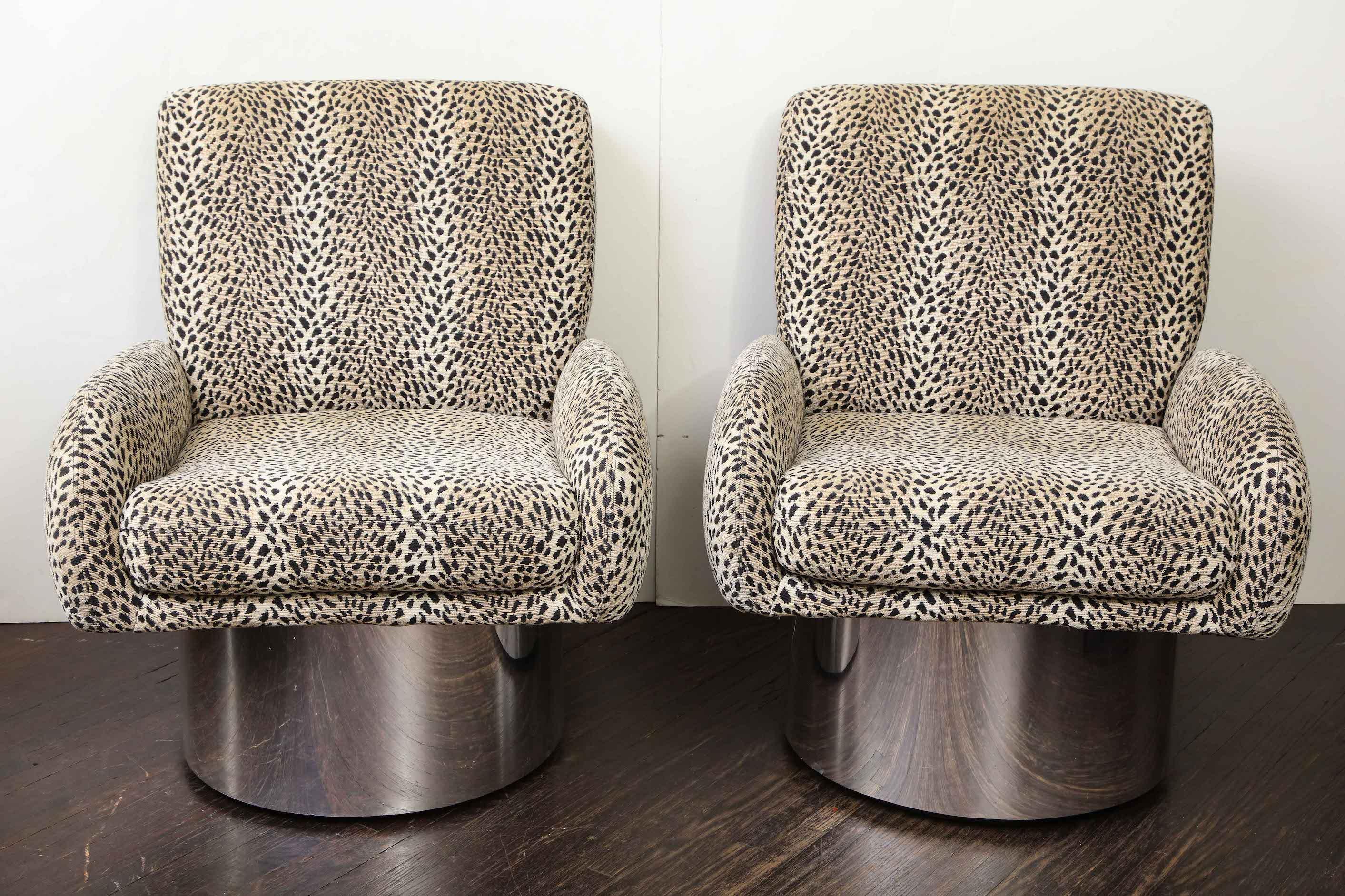 Pair of Leon Rosen swivel chairs.