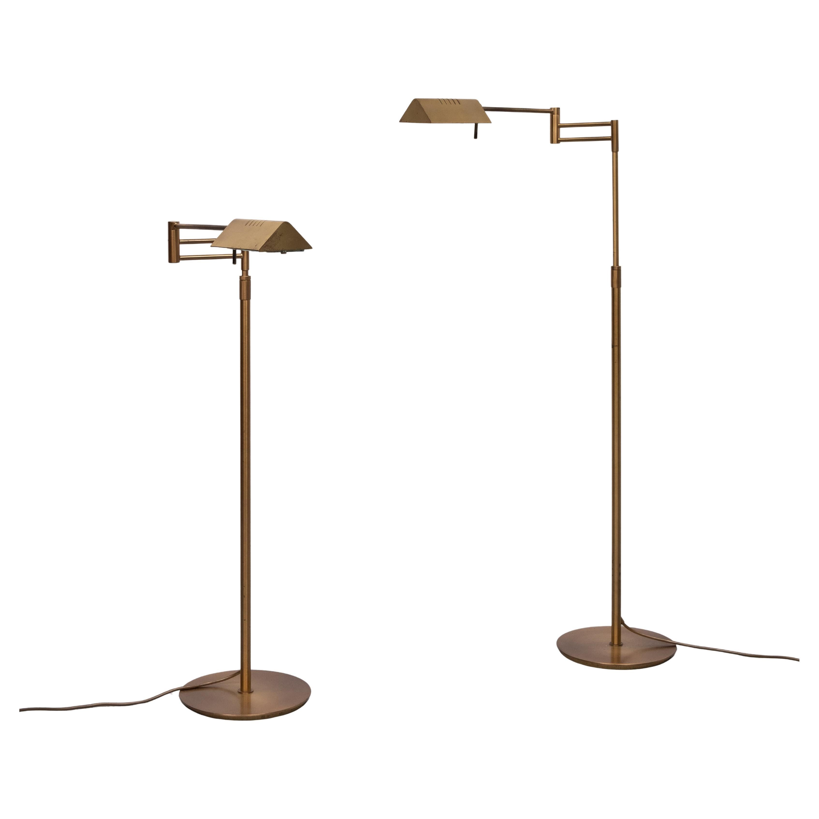 Library Swing arm brass floor lamps . Halogen . comes with good working 
dimmers . Adjustable  in Height  .Very good quality lamps .Beautiful Bronze color . with just the right amount of Patine . Great looking set .



