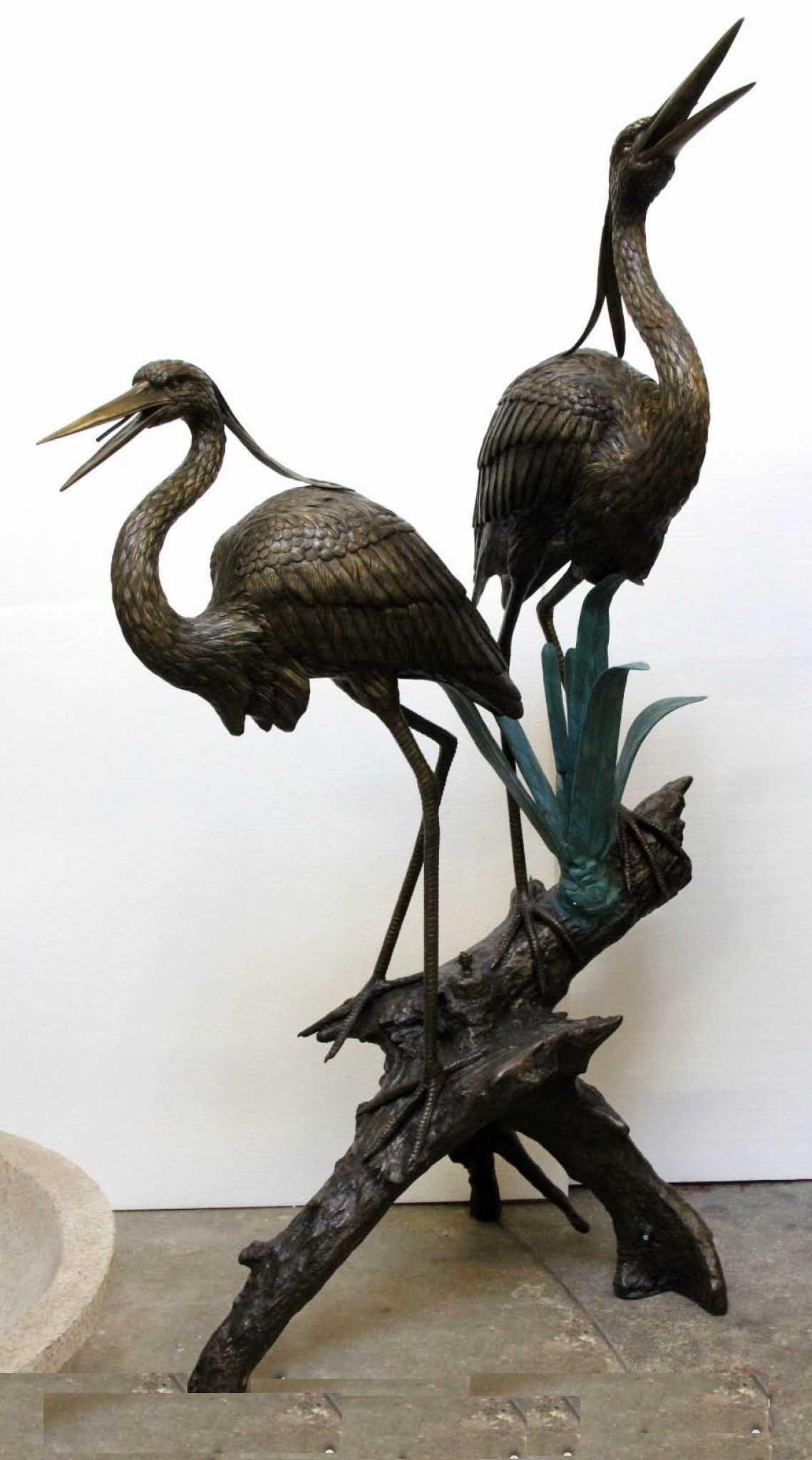 Gorgeous pair of lifesize bronze cranes
This is a fountain, water will spurt out of their beaks if hooked up to a water supply = great in a pond
Of course being bronze these can live outside with no fear of rusting
Stand in at almost 7 feet tall -