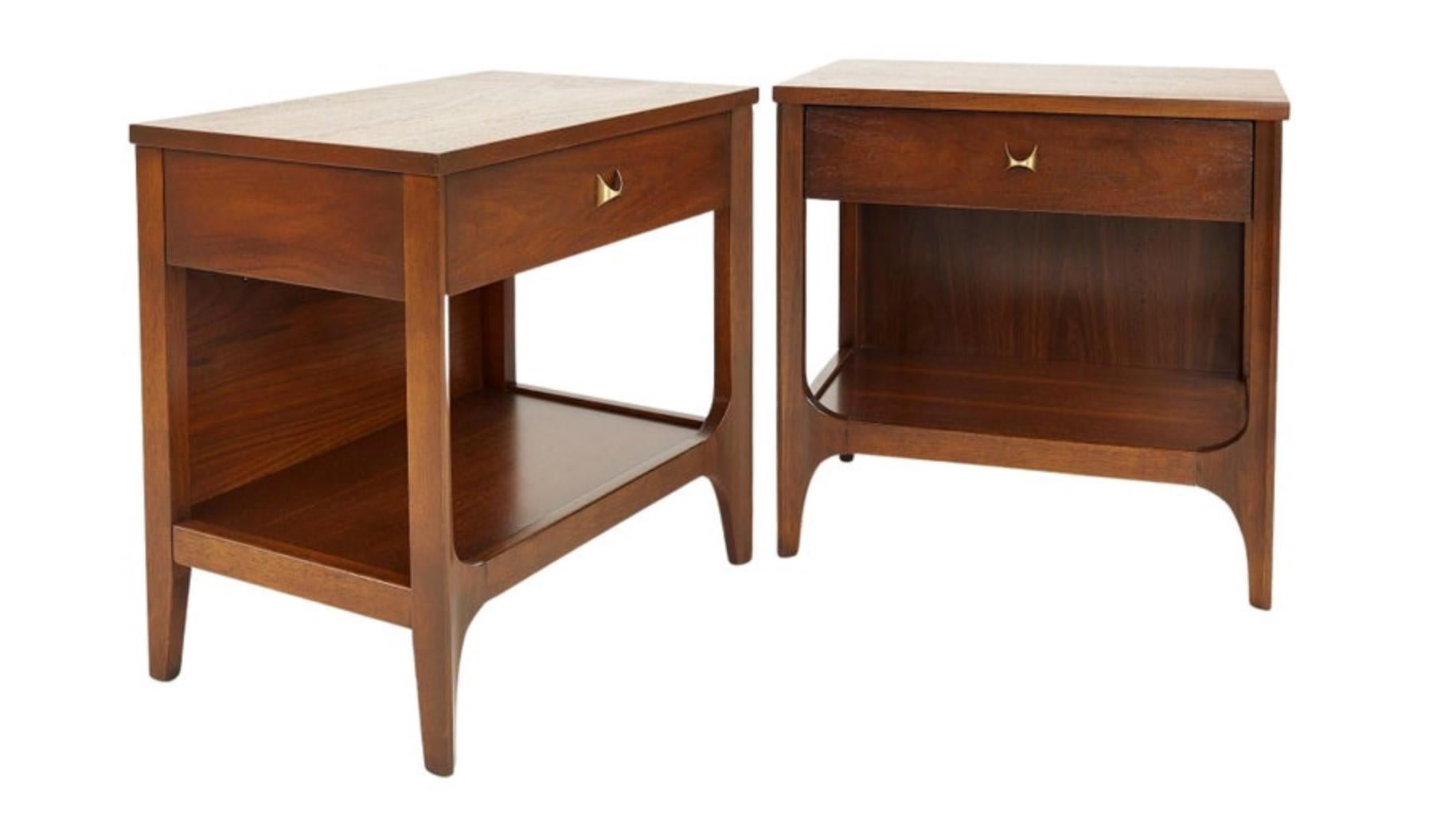 This fantastic pair of nightstands or end tables was built in the 1970s by high-end manufacturer Broyhill for their Brasilia line of furntiure. Since then, the Brasilia line has become more desirable, and original sets are difficult to come by.