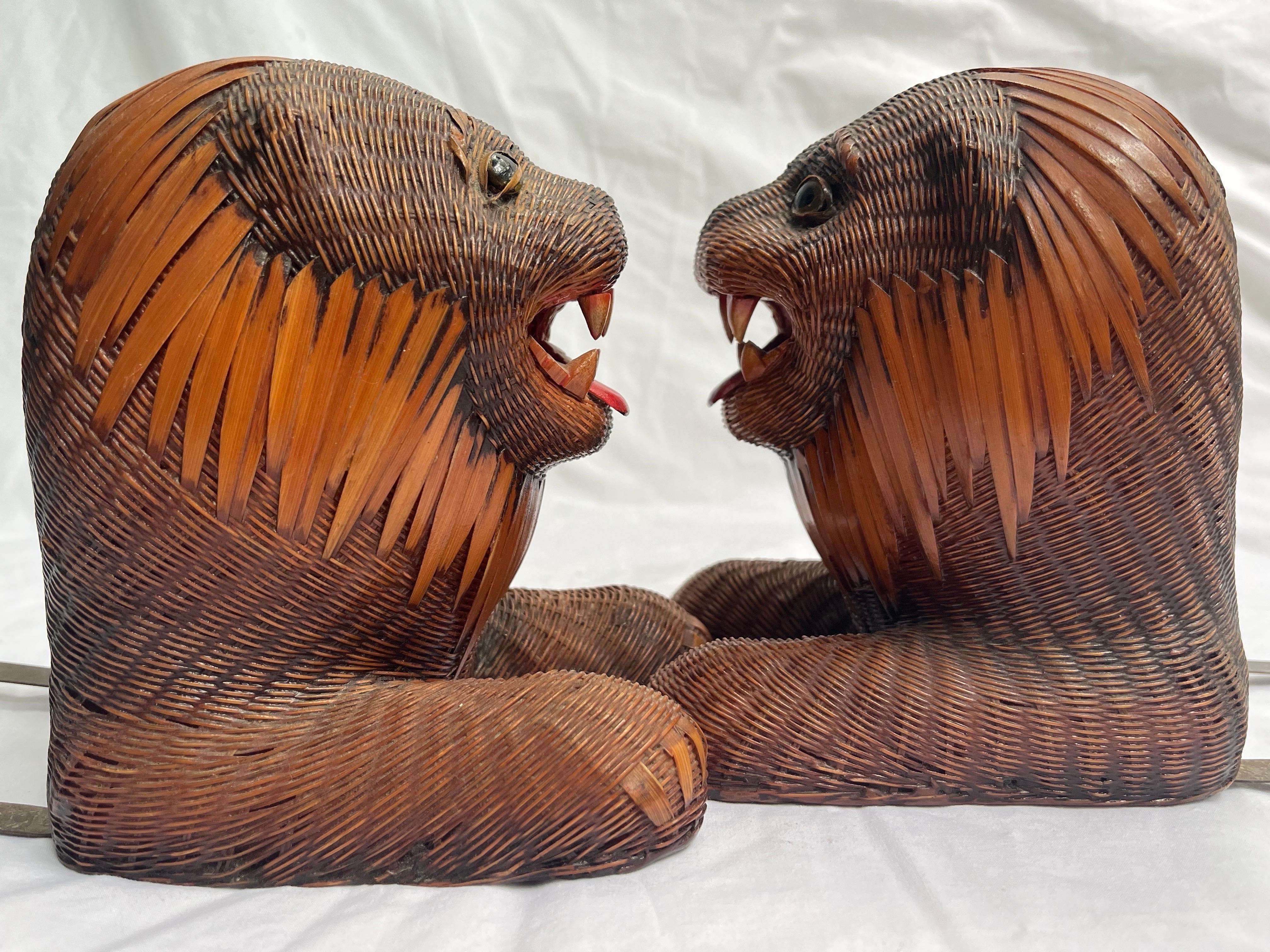 A beautiful pair of vintage circa 1970's roaring lion bookends most likely by the Shanghai Handicrafts Collection of China. The tightly woven thin reed or fine wicker forms a gorgeous pair of lions mounted as bookends. Their front paws are