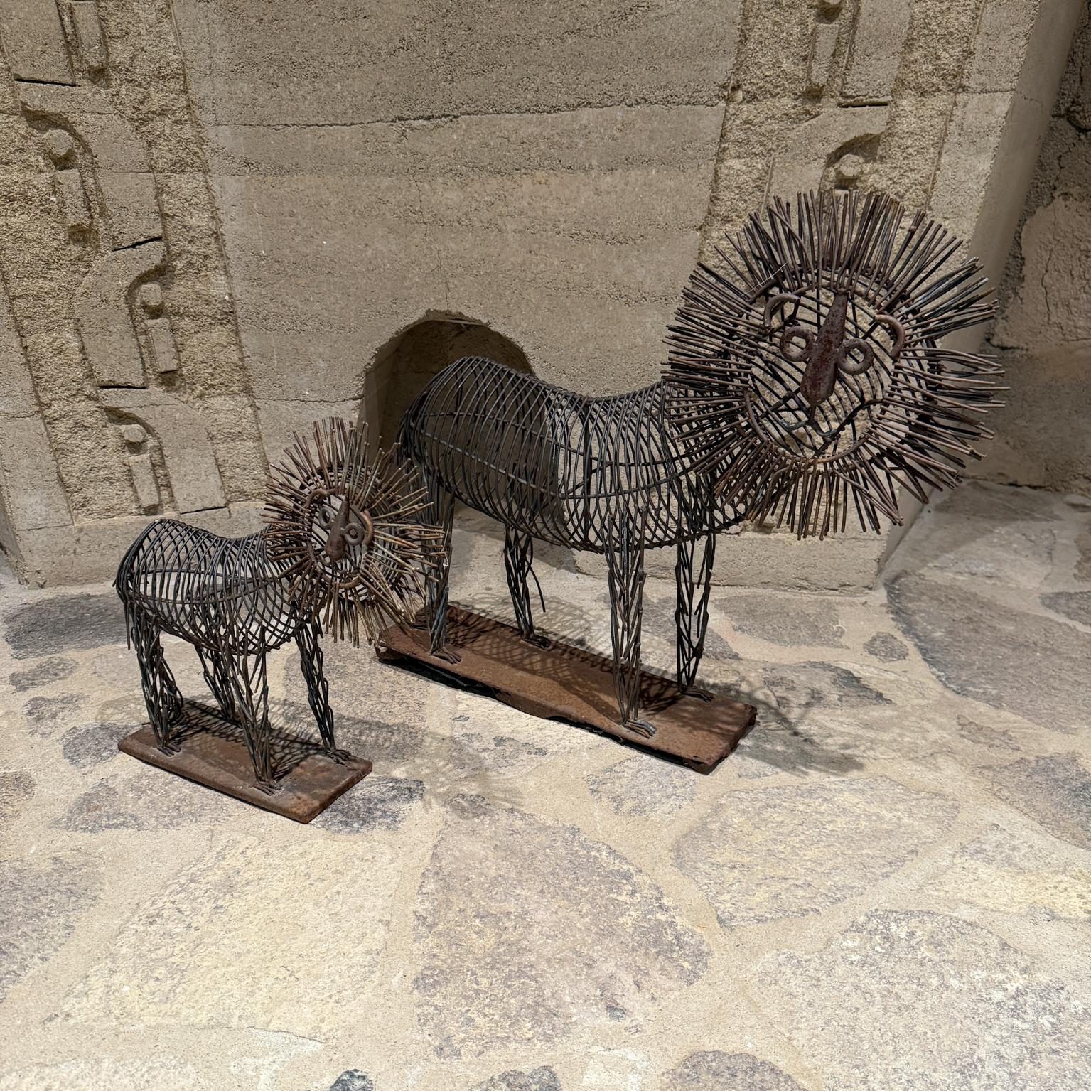 For your consideration a pair of two sculptures lions by Curtis Jere. Made of Iron.  Mid Century  period, USA. Unsigned. Circa the 1970s.

Dimensions: Big Cat 23 H x 27 W x 5.5D,  Small Cat 16 H x 16 W x 4 D.

Please visit take a look at our