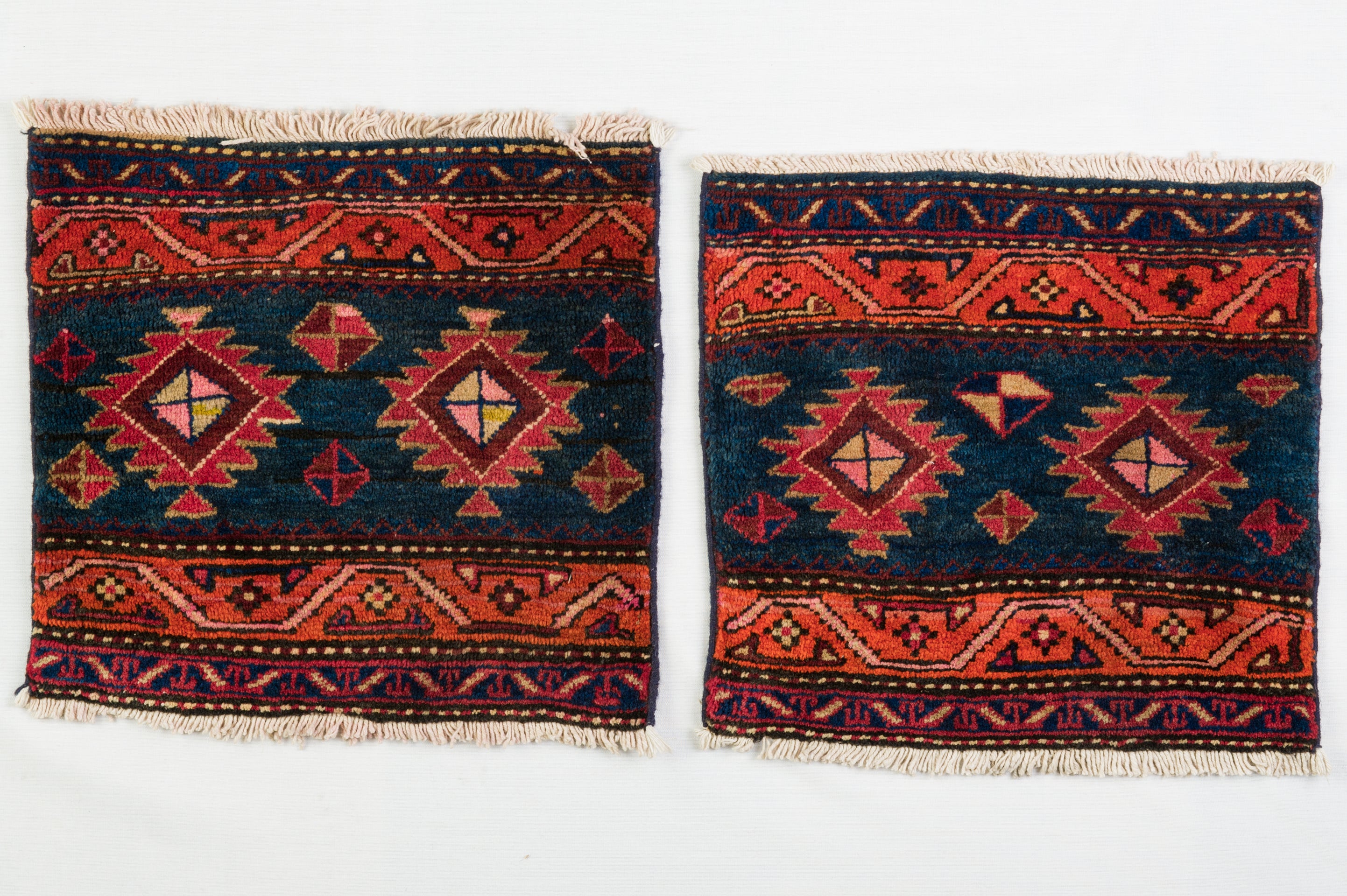 Rare little pair of Kurdistan rugs, recovered from an ancient saddlebag.: over time the central part has worn out .
You can use on two lounge chairs or with two little tables or making cushions.  These little carpets can be changed into newspaper