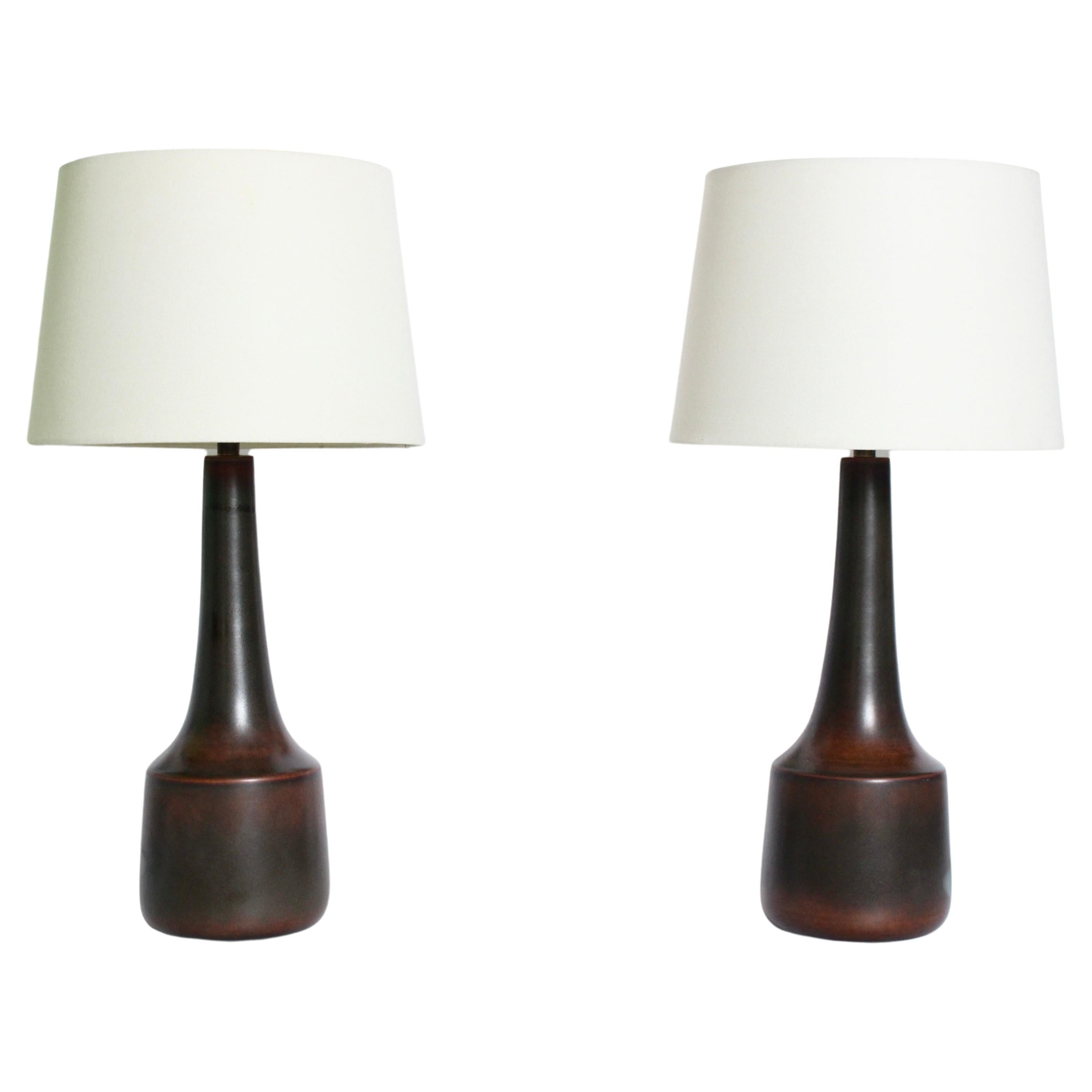 Taller pair of Lotte and Gunnar Bostlund glazed stoneware Table Lamps, C. 1970.  Featuring the classic Bostlund long neck bottle forms with color gradation from Chestnut (Pantone 160) at top and bottom to Dark Gray Green (Pantone 448) tones to neck