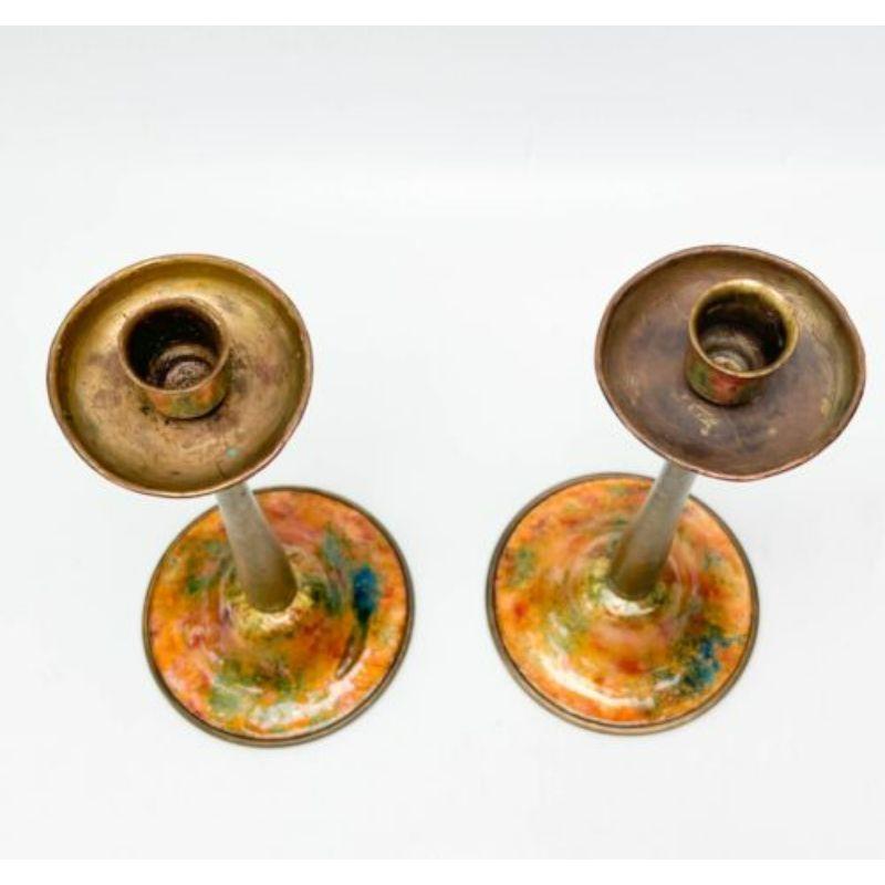 Pair Louis C Tiffany Furnaces Enamel & Gilt bronze candlesticks # 35 circa, 1925.

Gilt bronze candlesticks with multicolor enamel to the bases and tops. Underside marked Louis C. Tiffany Furnaces, Inc #35.

Additional information:
Type: Candle