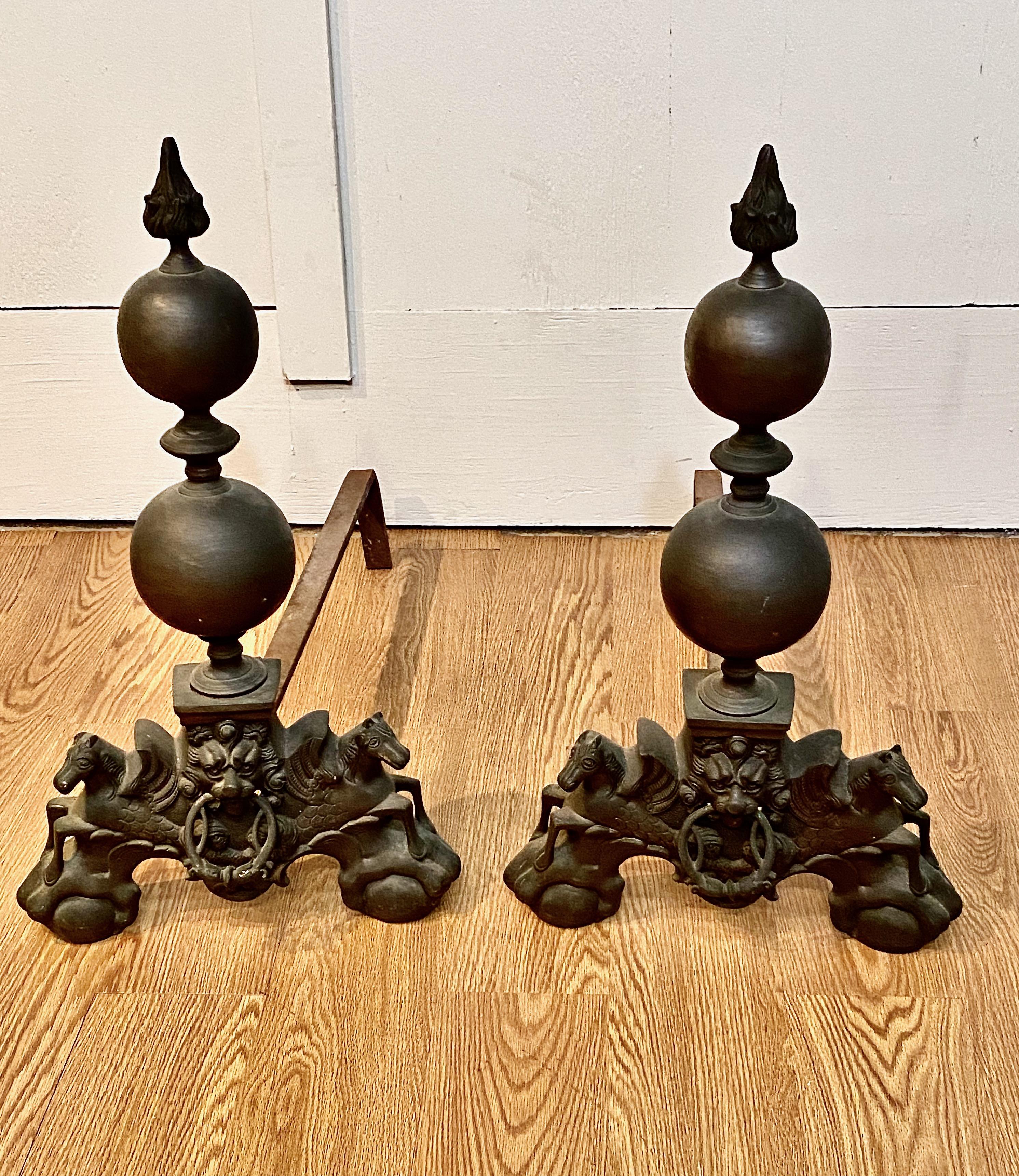 This is a superb pair of mid-19th century French bronze andirons in the Baroque Louis XIV taste. These guys have a wonderful hefty presence and could be fitted to Spanish, Italian, Dutch or Colonial inspired fire places. In addition to the horses