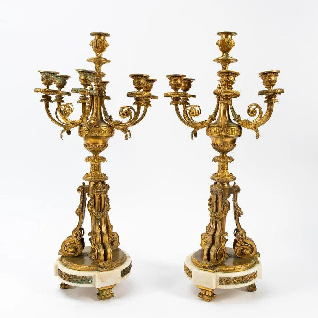 Continental pair of substantial bronze mounted green marble urn-form lamps in the Louis XVI taste, on socle plinths with square bases and pleated shades. Measures: Height. 33.25