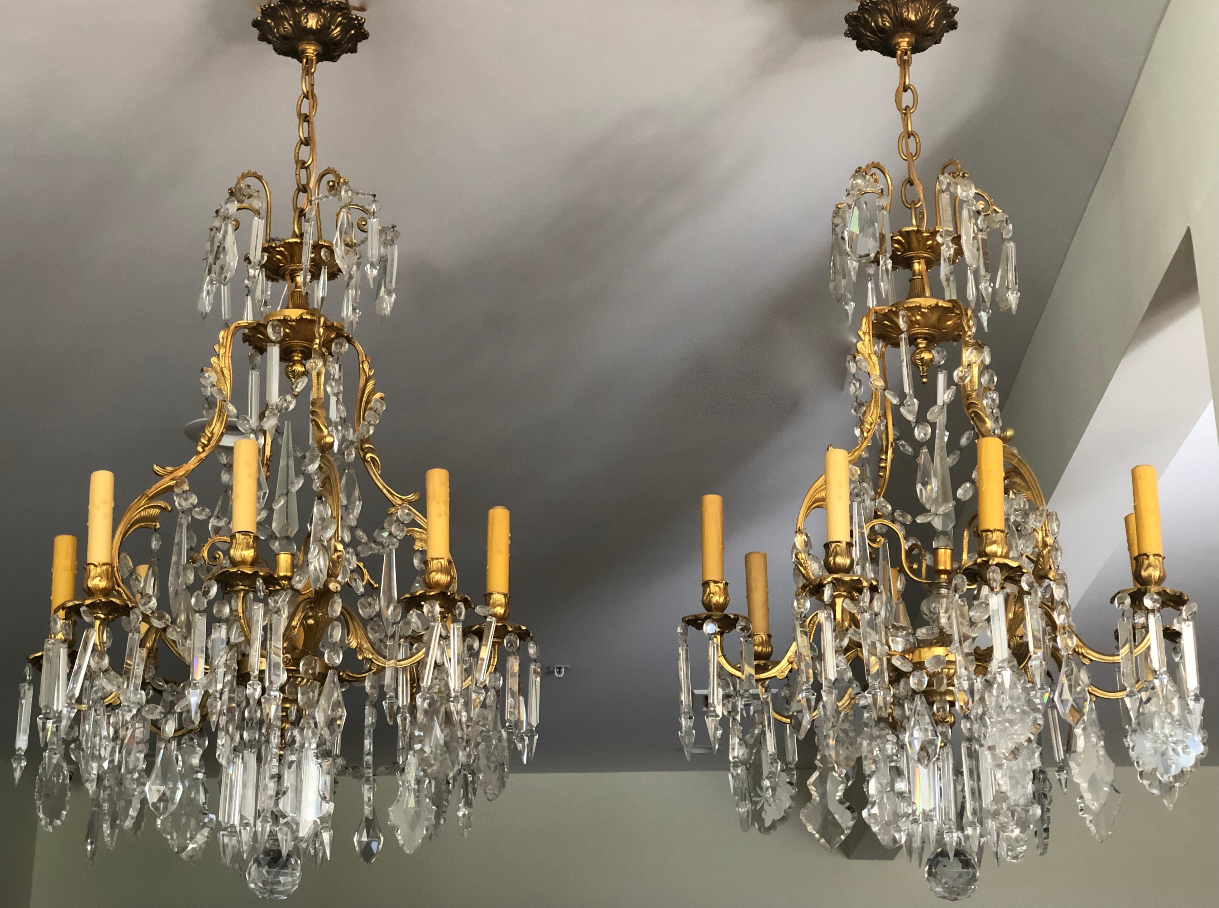 Pair of fine quality French 19th century Louis XV chandeliers. 8 light.
Ormolu bronze and crystal with a Rococo influence. Fine casting and gilding.
Height is for chandelier and canopy. Any amount of chain can be used.