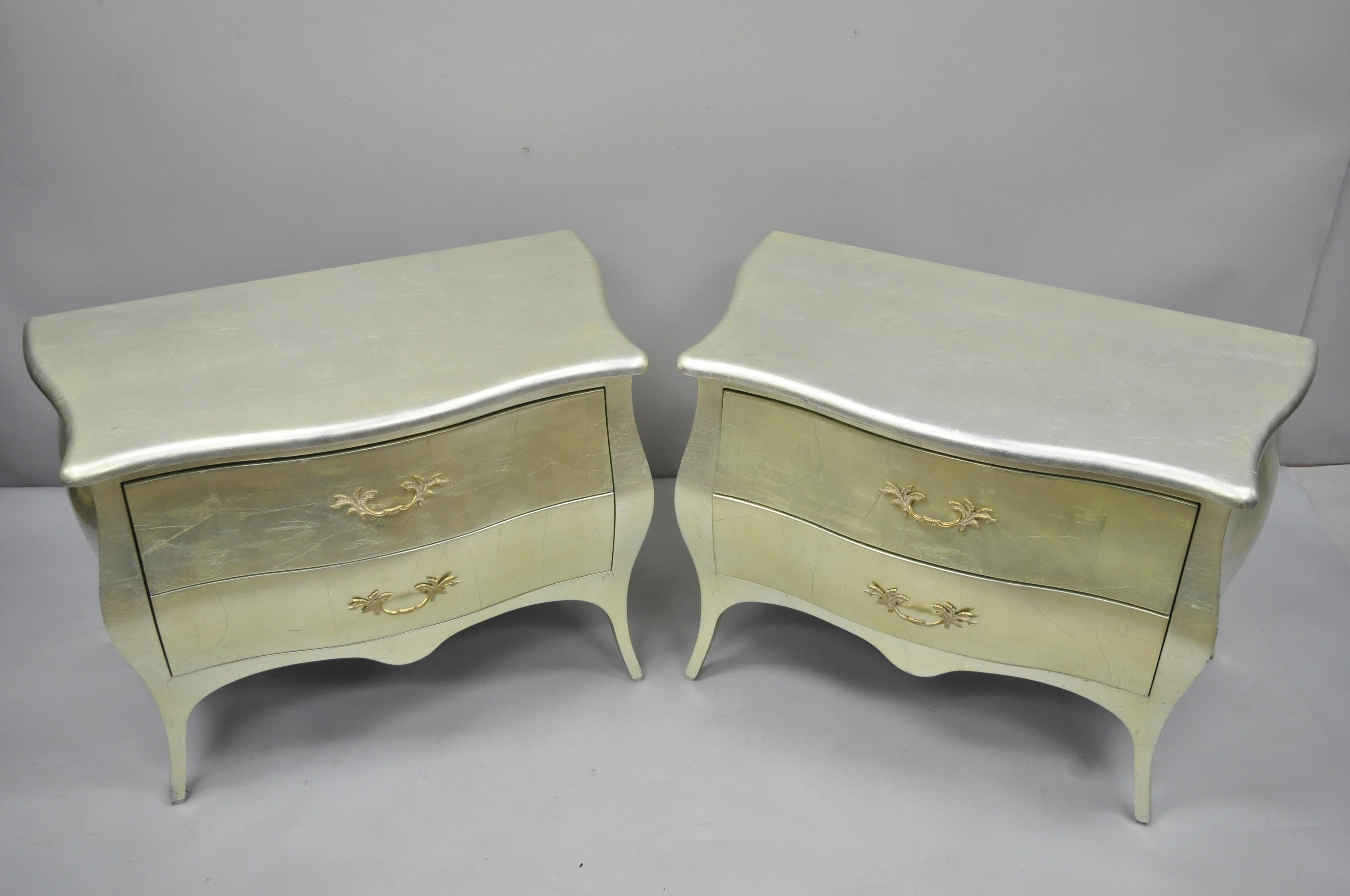 Pair of Louis XV French Hollywood Regency style bombe commode nightstands by Jimeco. Item features silver or gold leaf finish, shapely bombe form, original label, 2 drawers, tapered legs, solid brass hardware, great style and form. Late 20th
