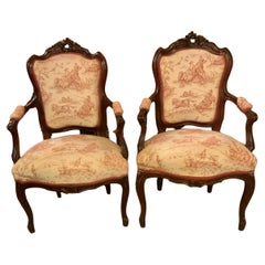 Antique Pair Louis XV-Style Arm Chairs in Walnut with Carved Cartouche Toile Upholstery