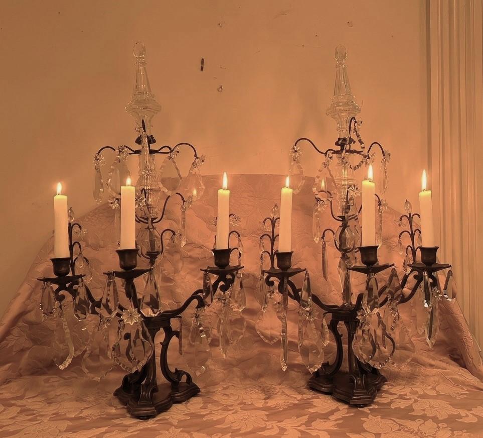 These Belle Epoque 3-light candelabra are the very essence of elegance and romance. Use them for evening parties or intimate dinners and they will add a warm glow and sparkle. The pair's frames are hand-wrought bronze with hand cut and formed