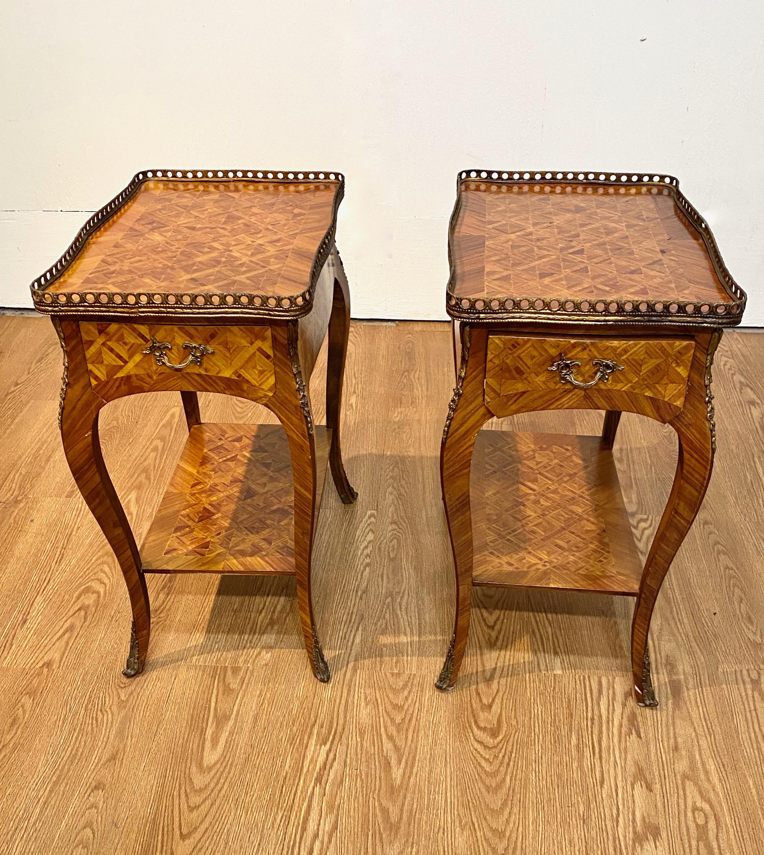 This is a very chic pair of early 20th century French parquetry petit side tables. The tables feature fine craftsmanship, deco-inspired geometric parquetry, all surfaces detailed in fine parquetry and, (piece de resistance) --small leather lined