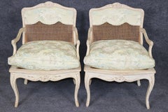 Pair Louis XV Style French Cream Distressed Painted Cane Back Armchairs
