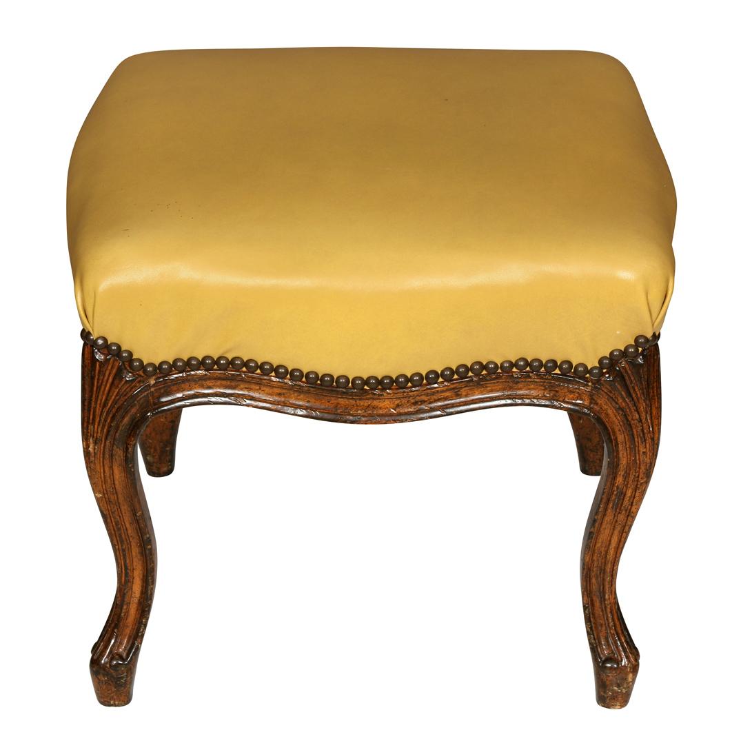 Pair of Louis XV style yellow leather upholstered benches with nailhead trim.