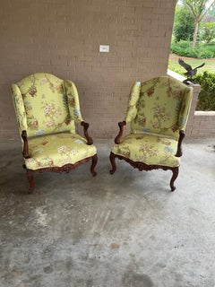 Pair regence style walnut wingback armchairs