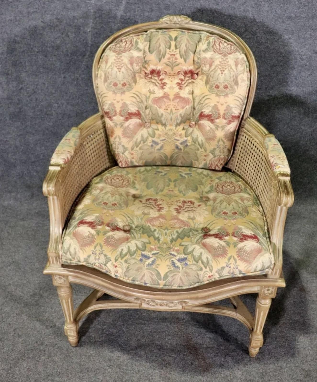 Pair of vintage armchairs with caned seats, sides, and backs. Plump cushioned seats and back pillow match the arm rests.
Please confirm location NY or NJ