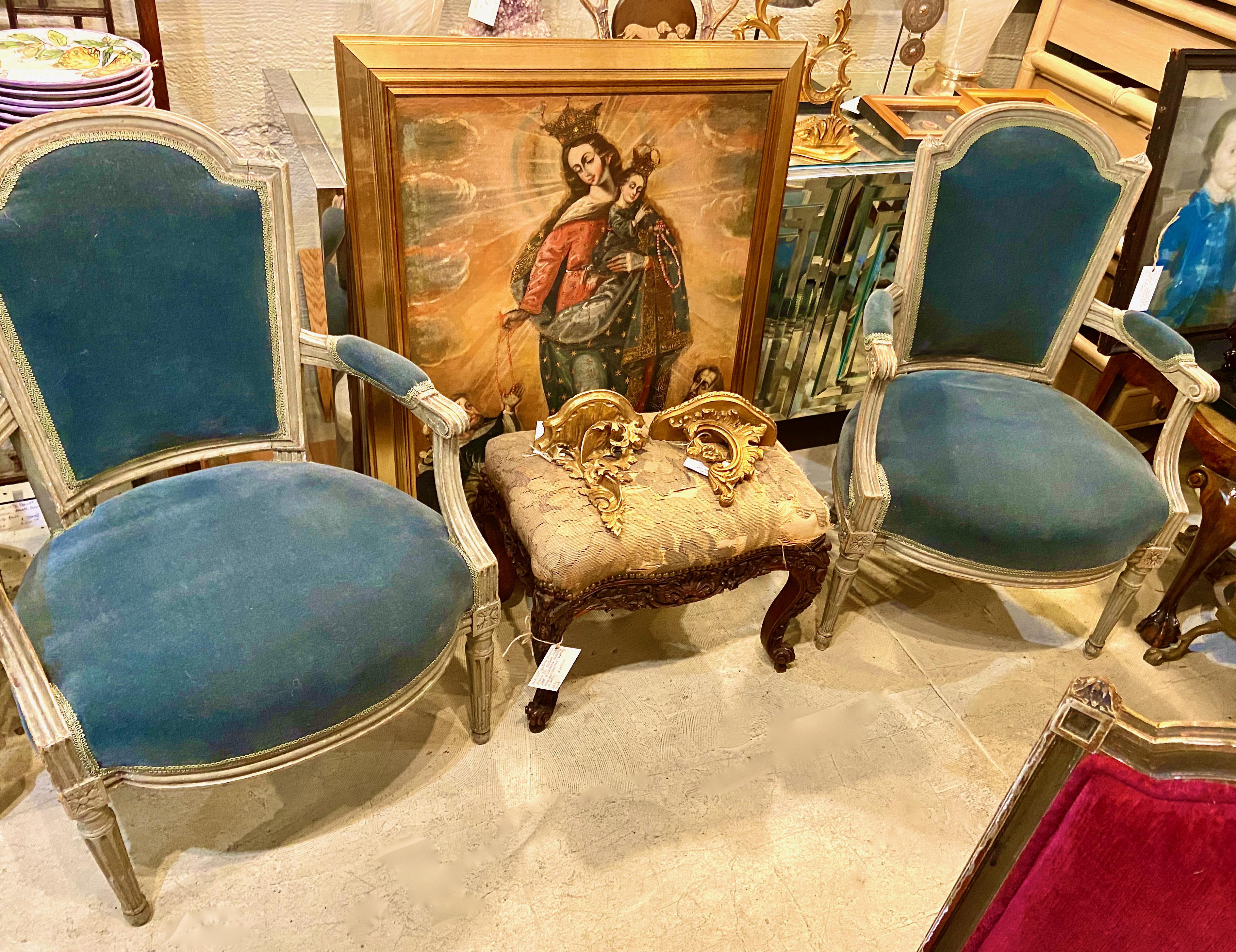 This is a great pair of Louis XVI gray painted Fauteuils. Both chairs are in overall very good condition and retain their original painted surface with some refreshing. The chairs are newly upholstered in a high-end gray/glue/green mohair velvet.