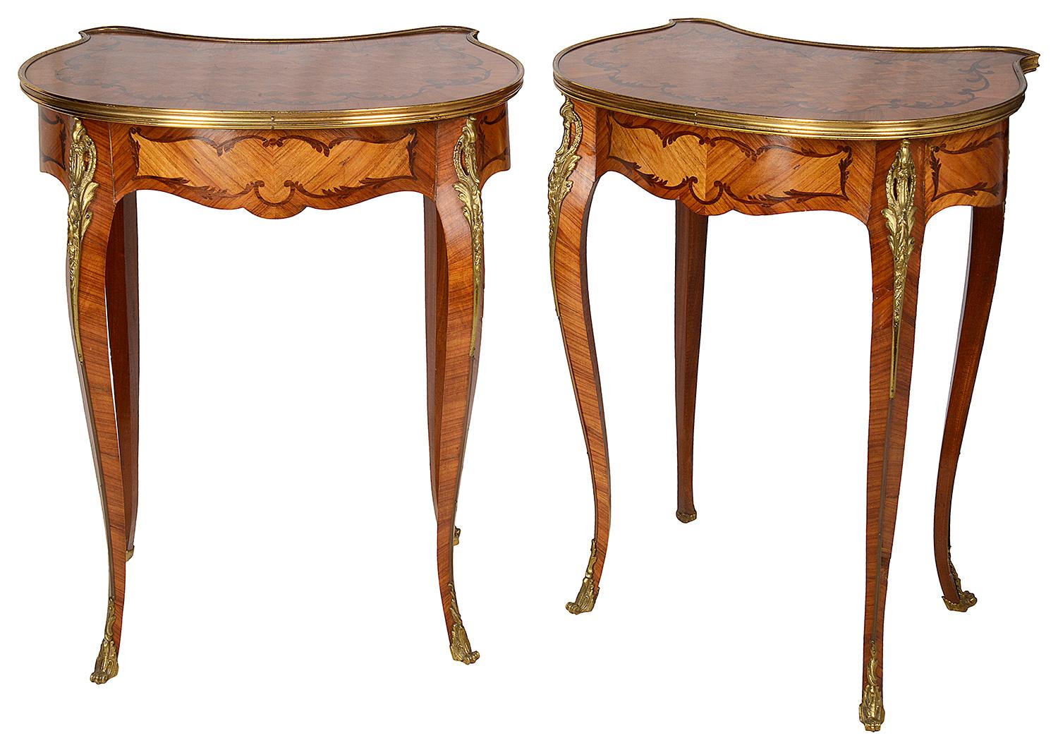 A good quality pair of Louis XVI style parquetry inlaid ormolu-mounted side tables, each with a single frieze drawers and raised on elegant cabriole legs terminating in scrolling ormolu feet.