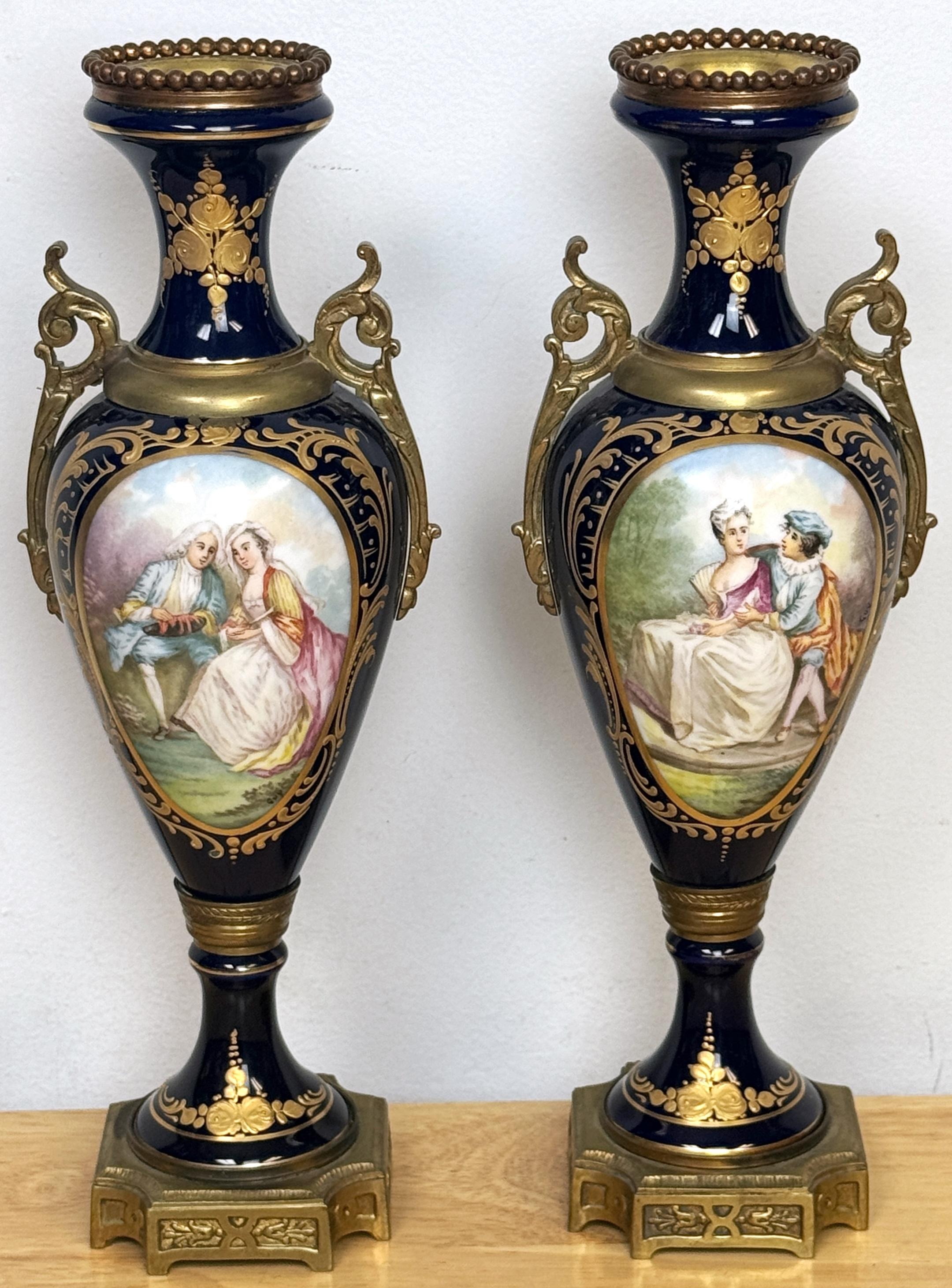 Pair Louis XVI Style Cobalt Sevres Style Ormolu Mounted Vases
France, circa 1900s

This elegant pair of Louis XVI-style cobalt Sevres-style ormolu-mounted vases, made in France circa 1900, exudes timeless sophistication. Each vase stands 12 inches