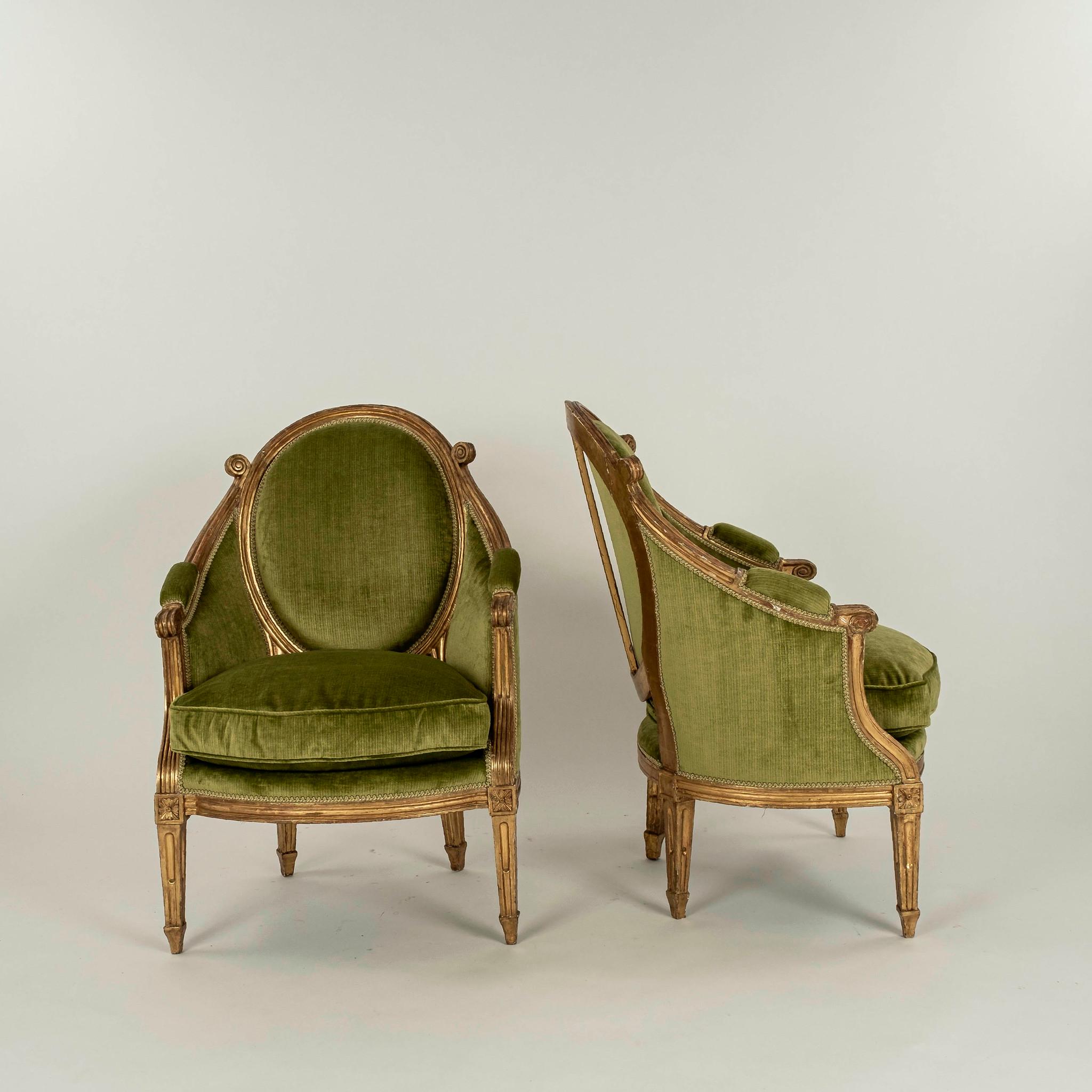 A pair of late 19th Century Italian Louis XV style oval back of bergeres upholstered in a green striated velvet.