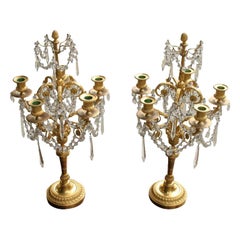 Paire de candélabres de style Louis XVI en bronze doré et cristal 