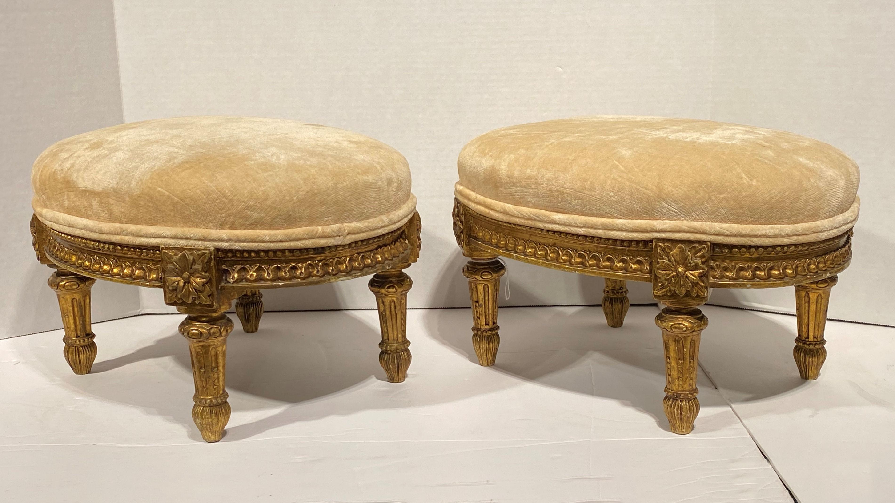 Pair of French 19th century Louis XVI style giltwood foot stools.