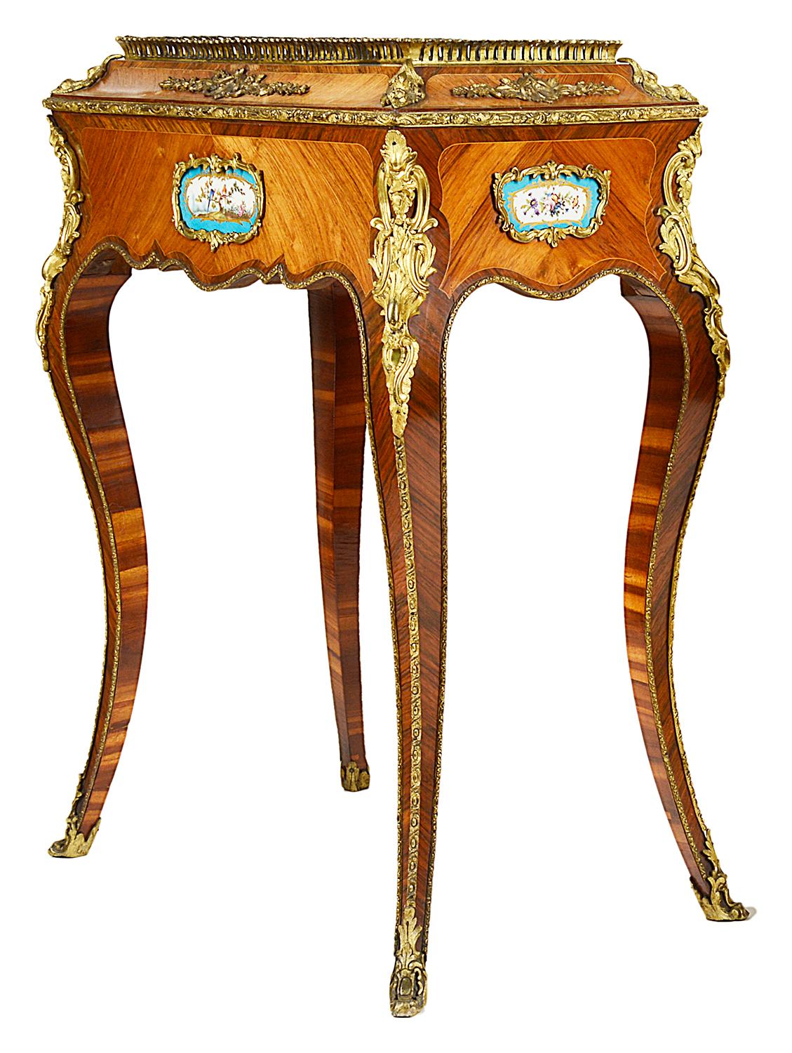 A good quality pair of French Kingwood, ormolu-mounted jardinières, each with zinc liners, ormolu galleries, Sevres style porcelain plaques and raised on elegant cabriole legs.