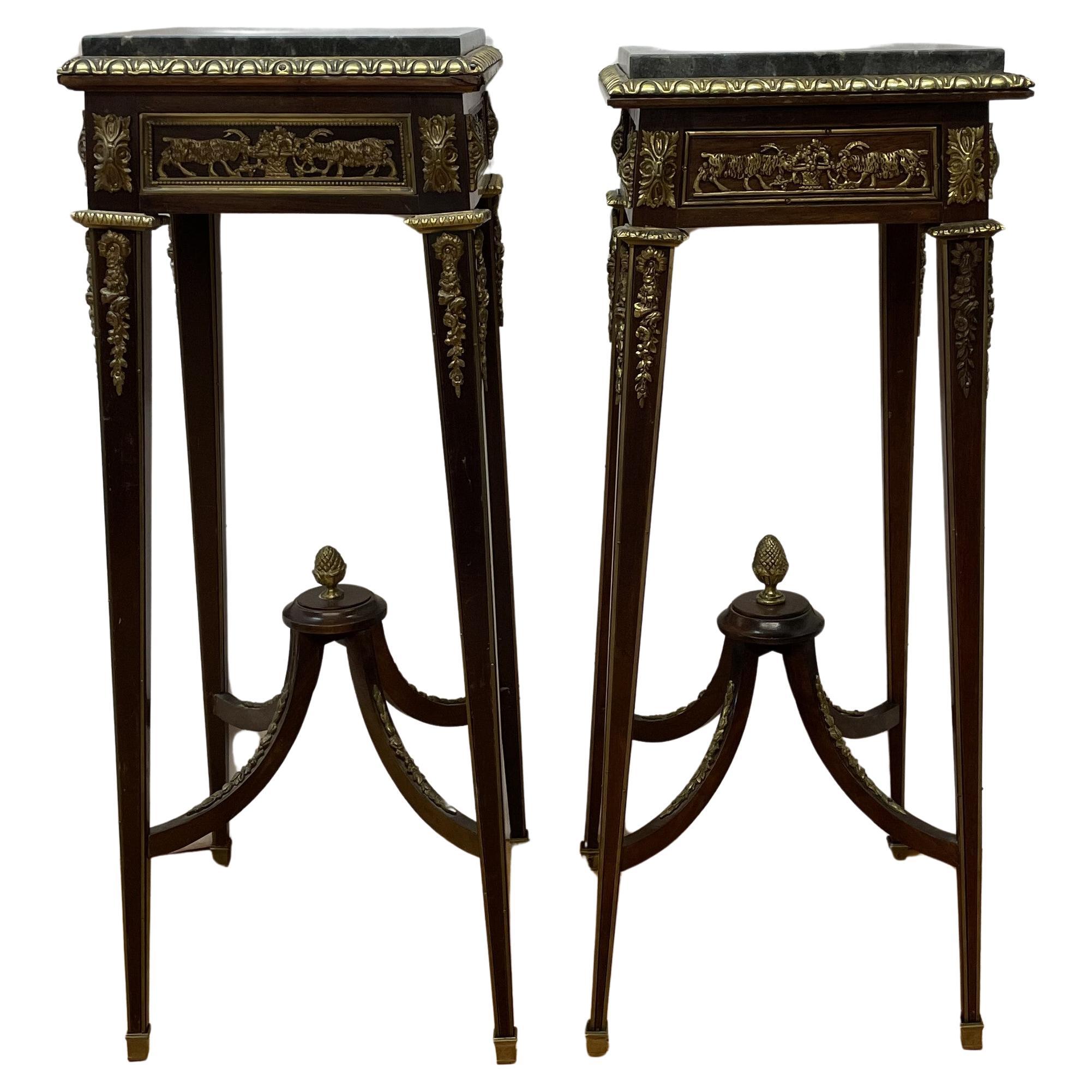 Pair Louis XVI style ormolu mounted stands with ram-head design and marble tops  For Sale